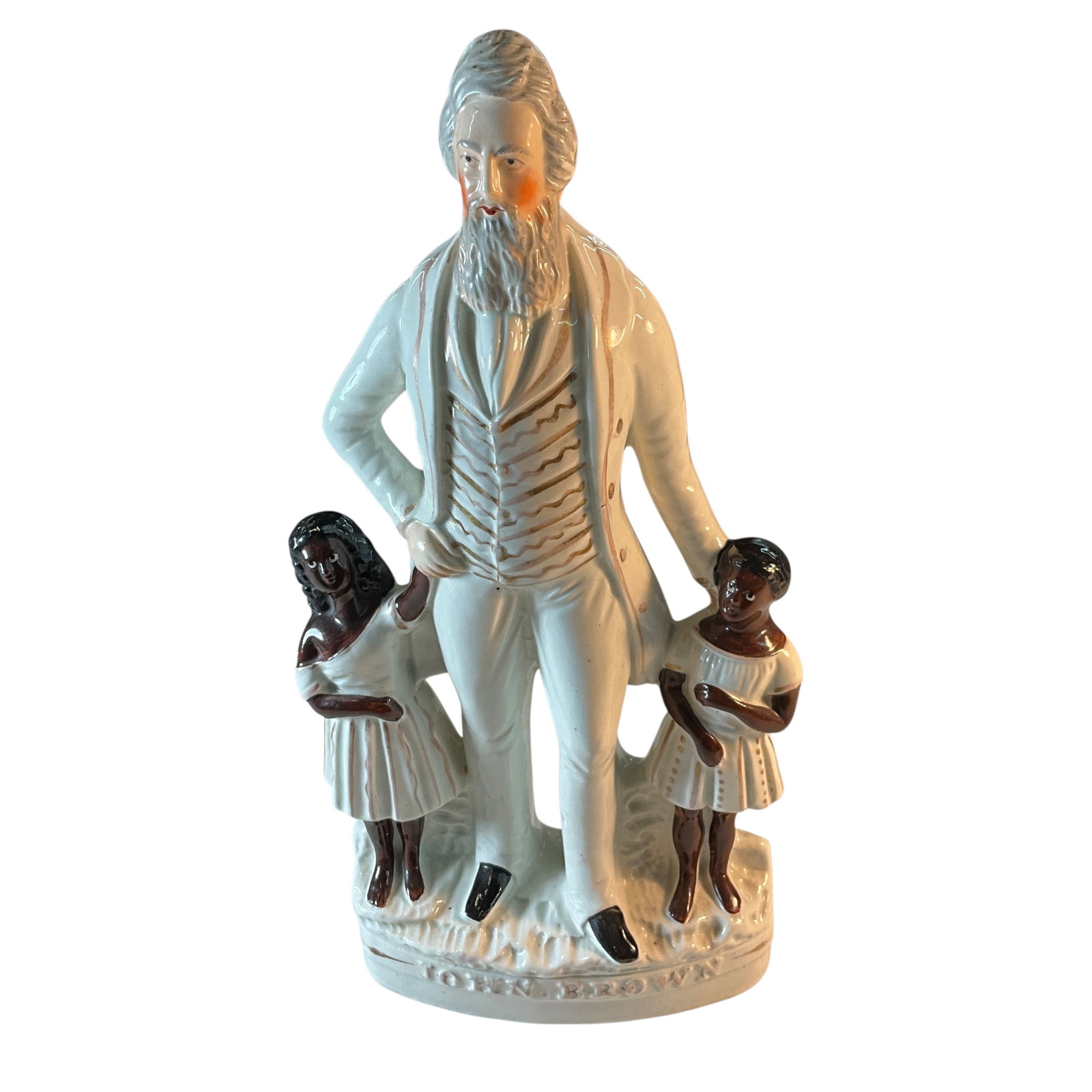 Staffordshire John Brown Abolitionist Figurine, C. 1859: Staffordshire John Brown Abolitionist Figurine, C. 1859. 13.25" tall figure of John Brown, accompanied by two young children of color. John Brown in raised letters on base. No noted chips or cracks.