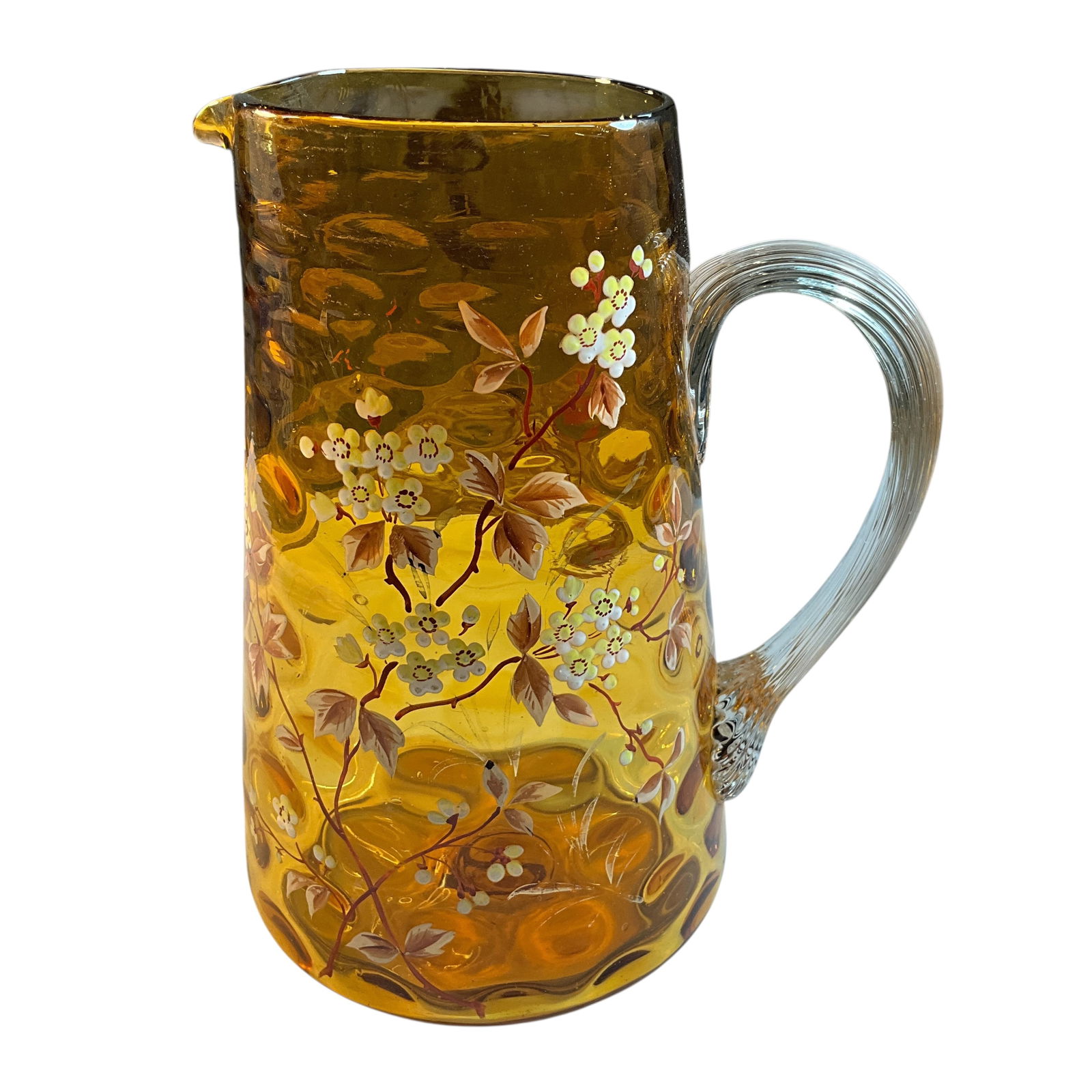 Victorian Amber Glass Enameled Pitcher: Victorian Amber Blown Glass Enameled Pitcher. Inverted Coin Dot amber glass pitcher with enameled flower and foliage decoration. Applied clear glass ribbed handle; pontil on bottom of pitcher. Approx.