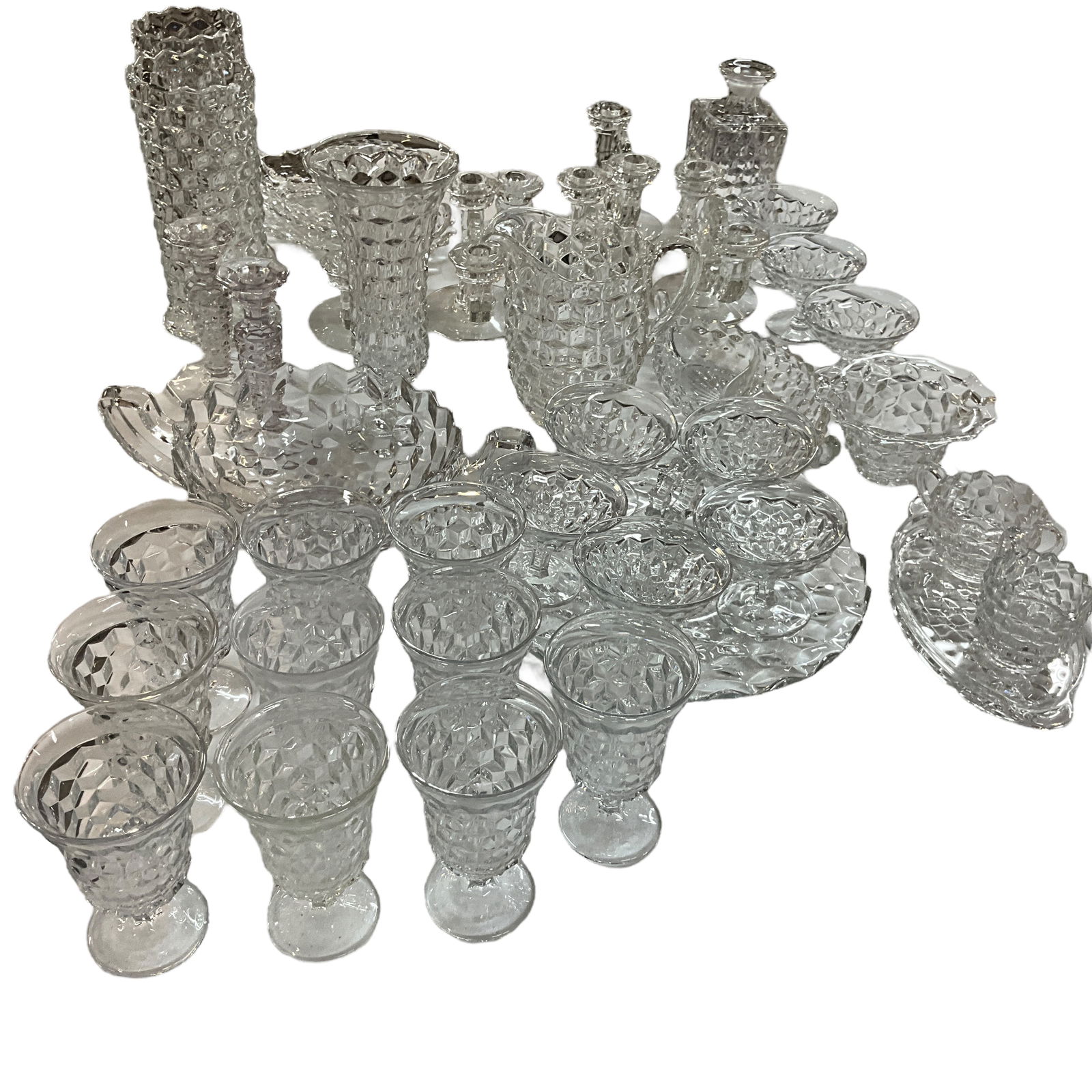 Huge Grouping of Fostoria Americana: Huge Grouping of Fostoria Americana. A group of 39 pieces of Fostoria Americana, including goblets, sherbets, a decanter (no stopper), single and double candlesticks, and a number of individual servin