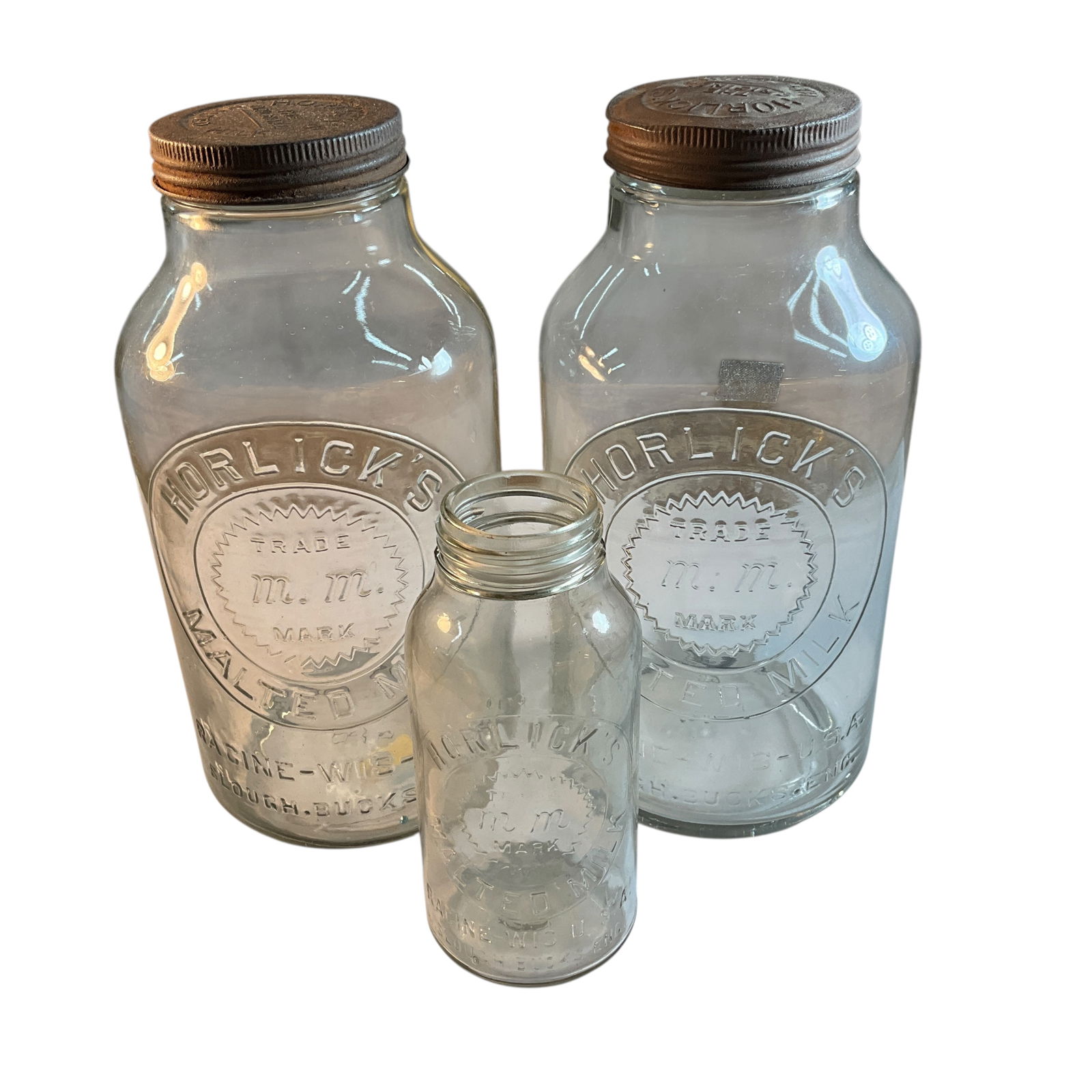 Trio of Horlick's Malted Milk Jars: Trio of Horlick's Malted Milk Jars. Two large size 11" jars with lids, and a smaller 7.25" jar without lid.