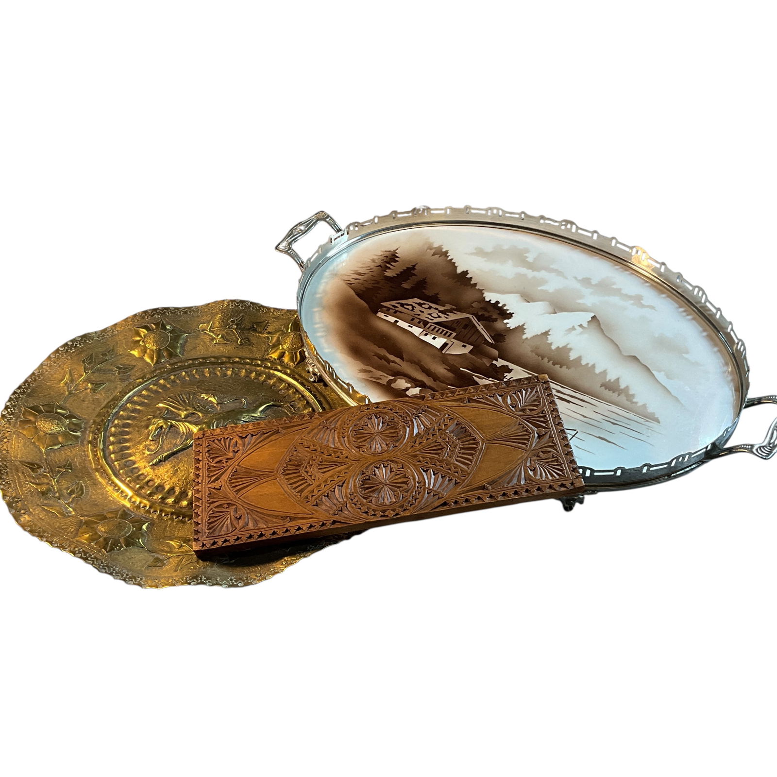 Pewter Framed Tray, Brass Tray, Carved Panel: Pewter Framed Tray, Brass Tray, Carved Panel. An oval ceramic tray with a pewter frame, depicting a mountain cabin on a lake. The brass tray is heavily embossed, with a griffin in the center, surround