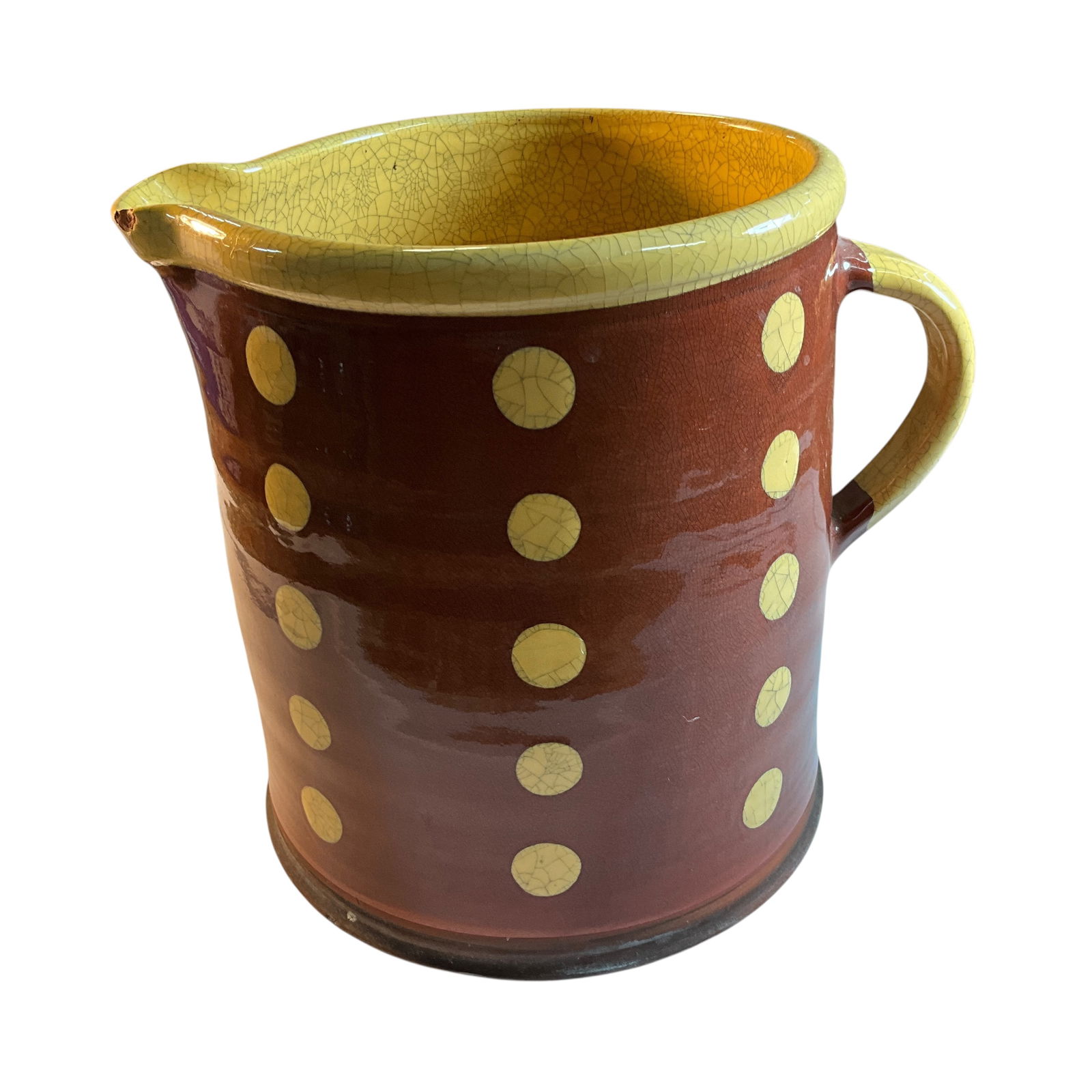 Huge Wisconsin Pottery Redware Pitcher: Huge Wisconsin Pottery Redware Pitcher. Red and yellow glaze with a linear polka dot pattern. Chip on the outside lip of the spout.