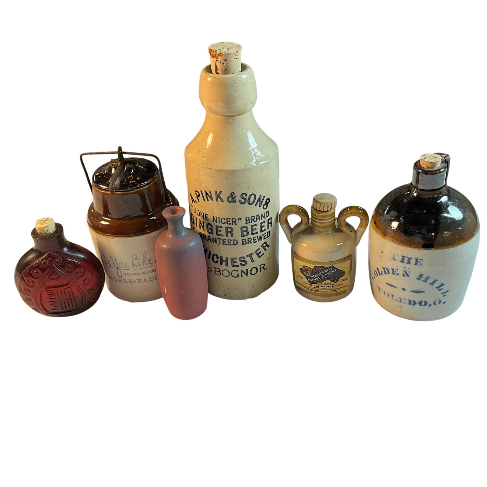 Group of 6 Stoneware Miniature Liquor/Food Bottles & crocks, Van Briggle: Group of 6 Stoneware Miniature Liquor/Food Bottles & crocks, Van Briggle. As You Like It Crock, Pinks Ginger Beer, Greybeard Scotch, etc. Also a small Van Briggle bottle, and a cut cranberry glass bot