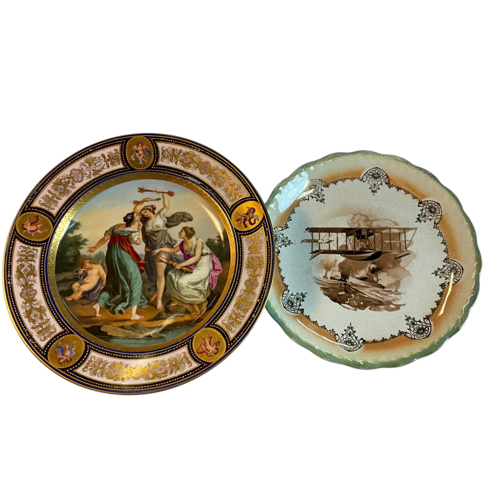 Two Vintage Plates: Two Vintage Plates- a wonderful 9.75" Royal Vienna cabinet plate with a central scene of three classically dressed women, stealing a sleeping Cupid's arrows. The inscription on the back reads "Der Ent