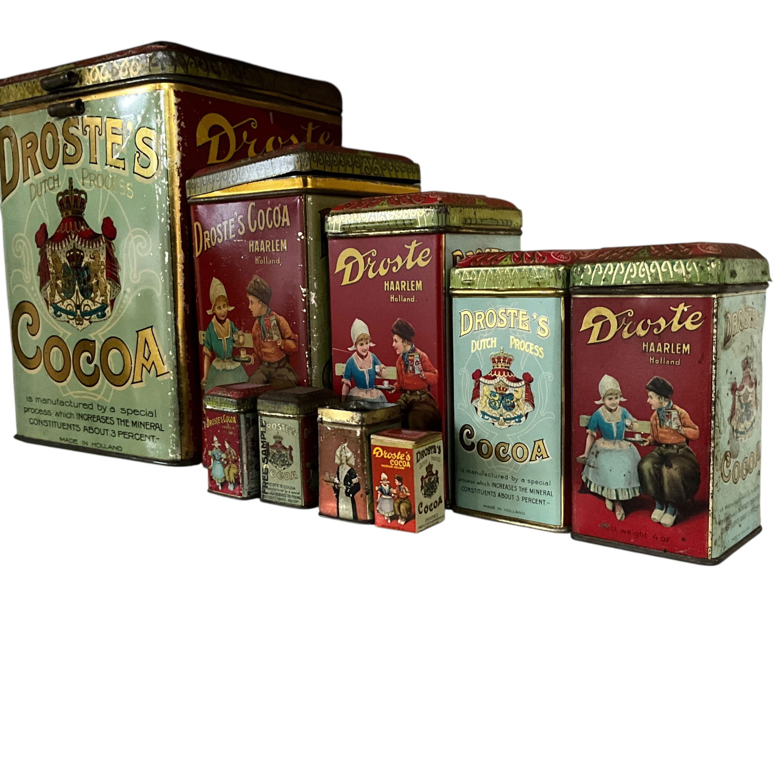 Nine Droste's Cocoa Tins- Graduated Sizes: Nine Droste's Cocoa Tins- Graduated Sizes. An instant collection! One each of 5 Lb, 1Lb, and 8 oz. sizes, two 4 oz. sizes, and four .25 oz. sample sizes- three tin and one cardboard example. One of th