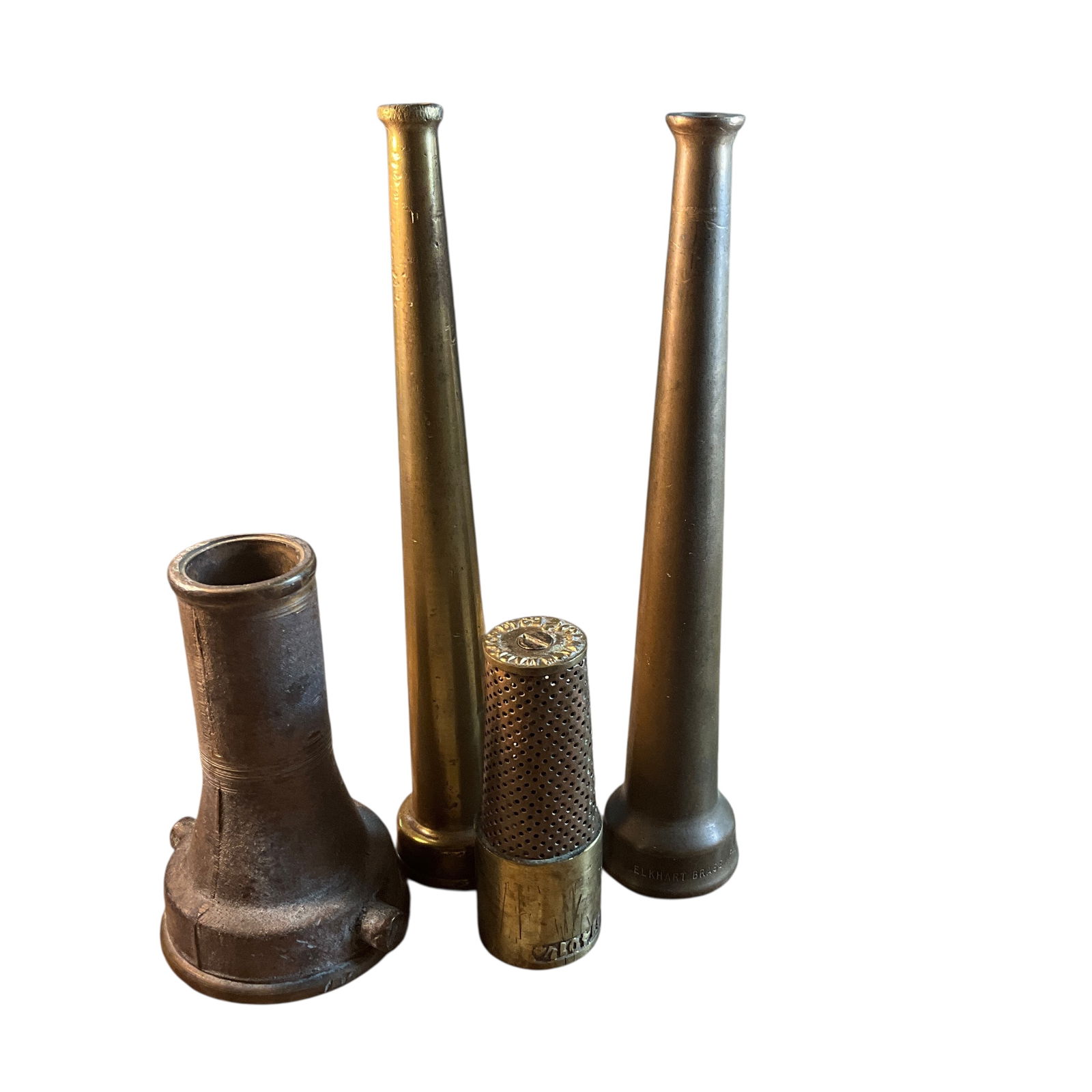 Group of Four Brass or Bronze Firefighting Nozzles: Group of Four Brass or Bronze Firefighting Nozzles. Various sizes and types, with small wooden "dog bone" display stands. Largest nozzle is approx. 12" Long