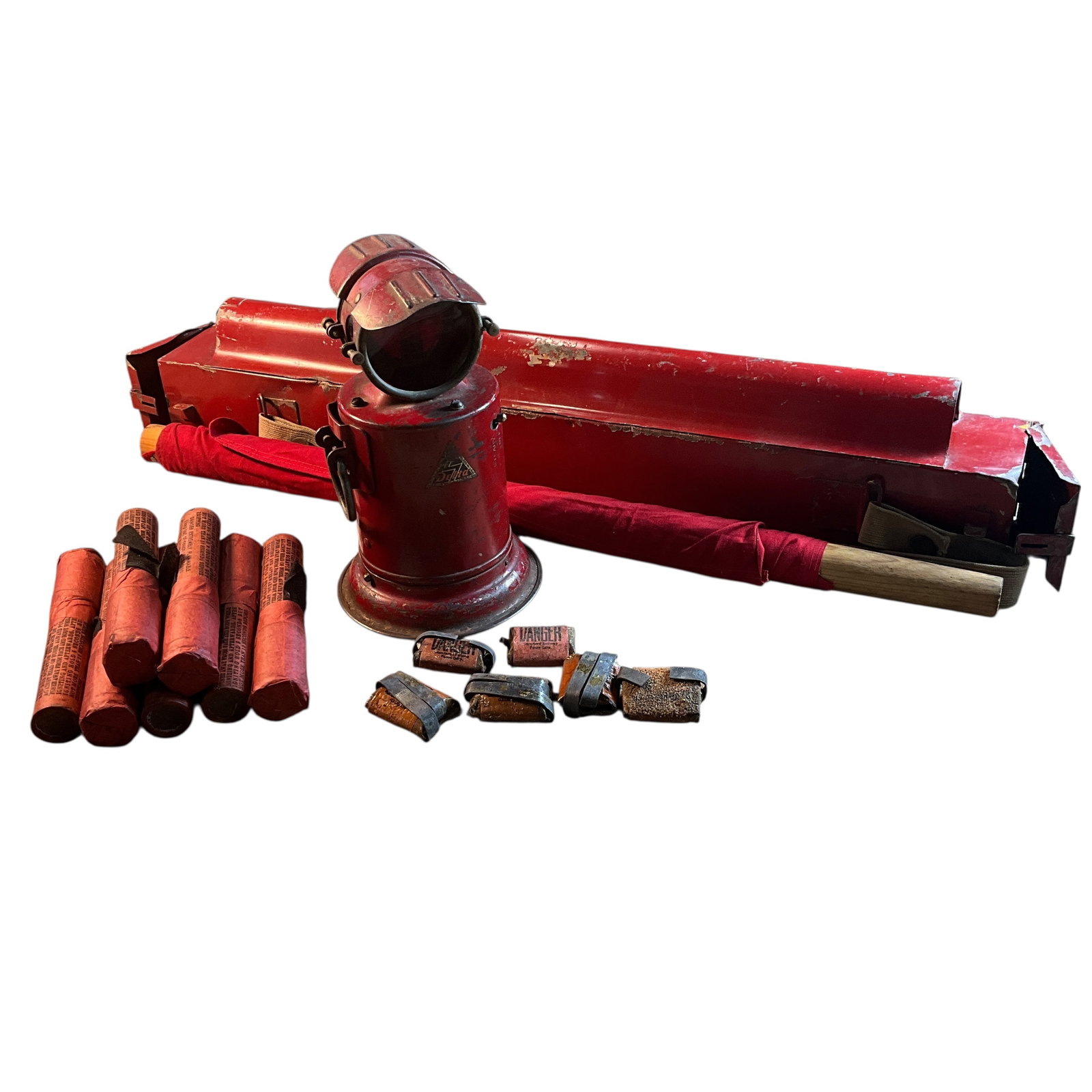 Pennsylvania Railroad Safety Kit: Pennsylvania Railroad Safety Kit. A red steel box with strap, containing six torpedoes and seven 6" flares (Fusees) in compartments at either end. A red flag is stored in a socket on the side. Carrier