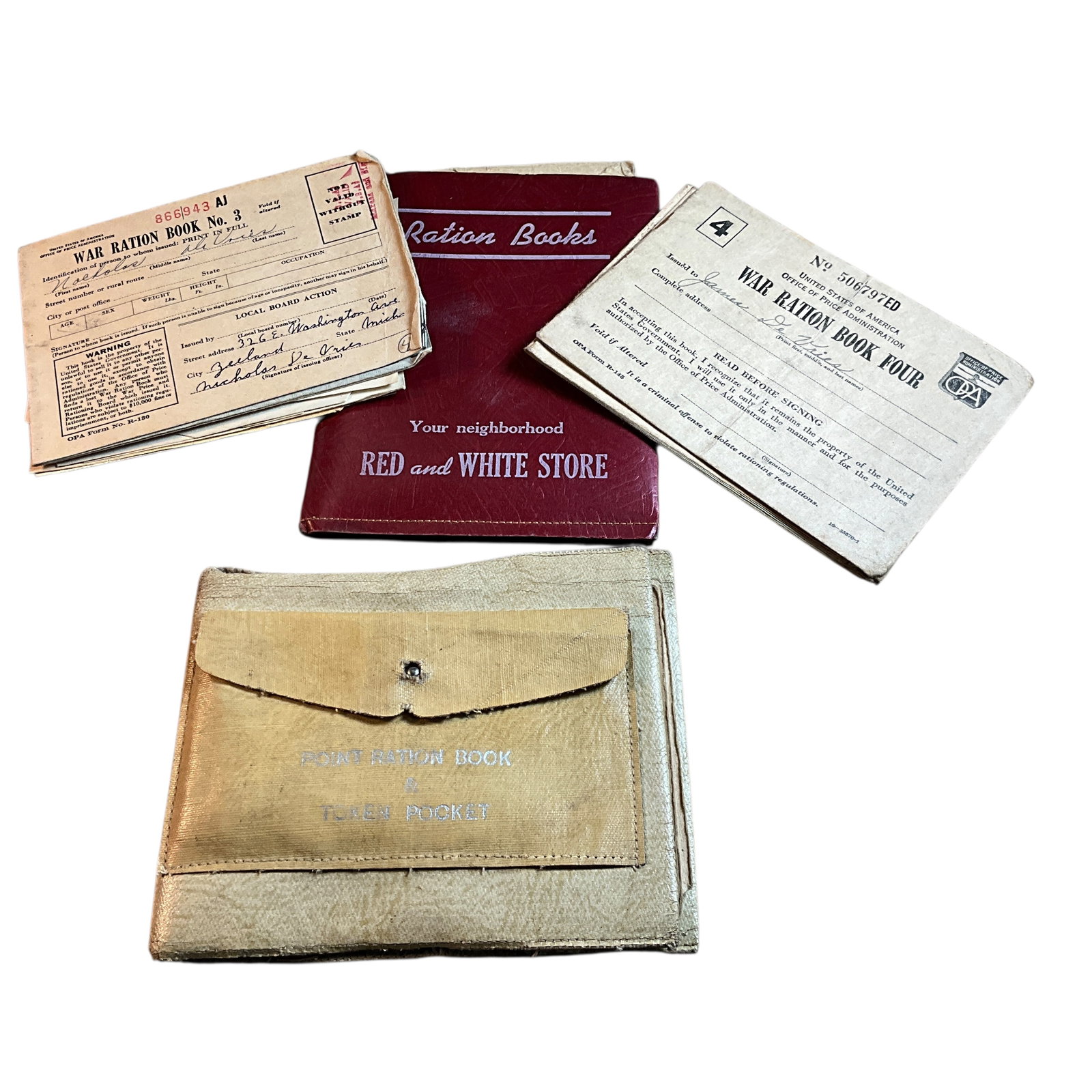 WWII Ration Books, Tokens & Holders.: WWII Ration Books, Tokens & Holders. Two ration book holders with series 3 and 4 books with lots of remaining stamps, as well as 15 red (Meats & Fats) tokens, and 5 blue (Processed foods) tokens, and 
