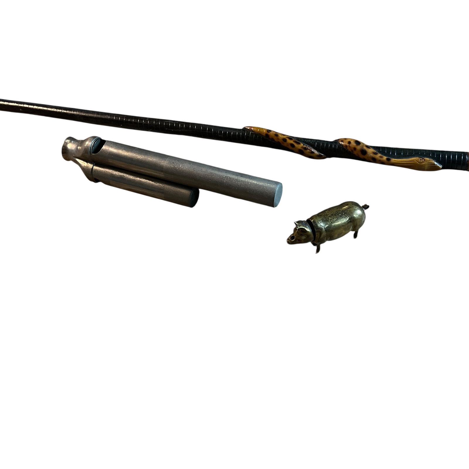 Tri-tone Conductor's whistle, Pig Match Safe, Hand Carved Swagger Stick: Tri-tone Conductor's whistle, Pig Match Safe, Hand Carved Swagger Stick. Antique Tri-tone or 3 barrel conductor's whistle, approx. 5.75" long. A brass pig match safe with striker belly. Also a souveni