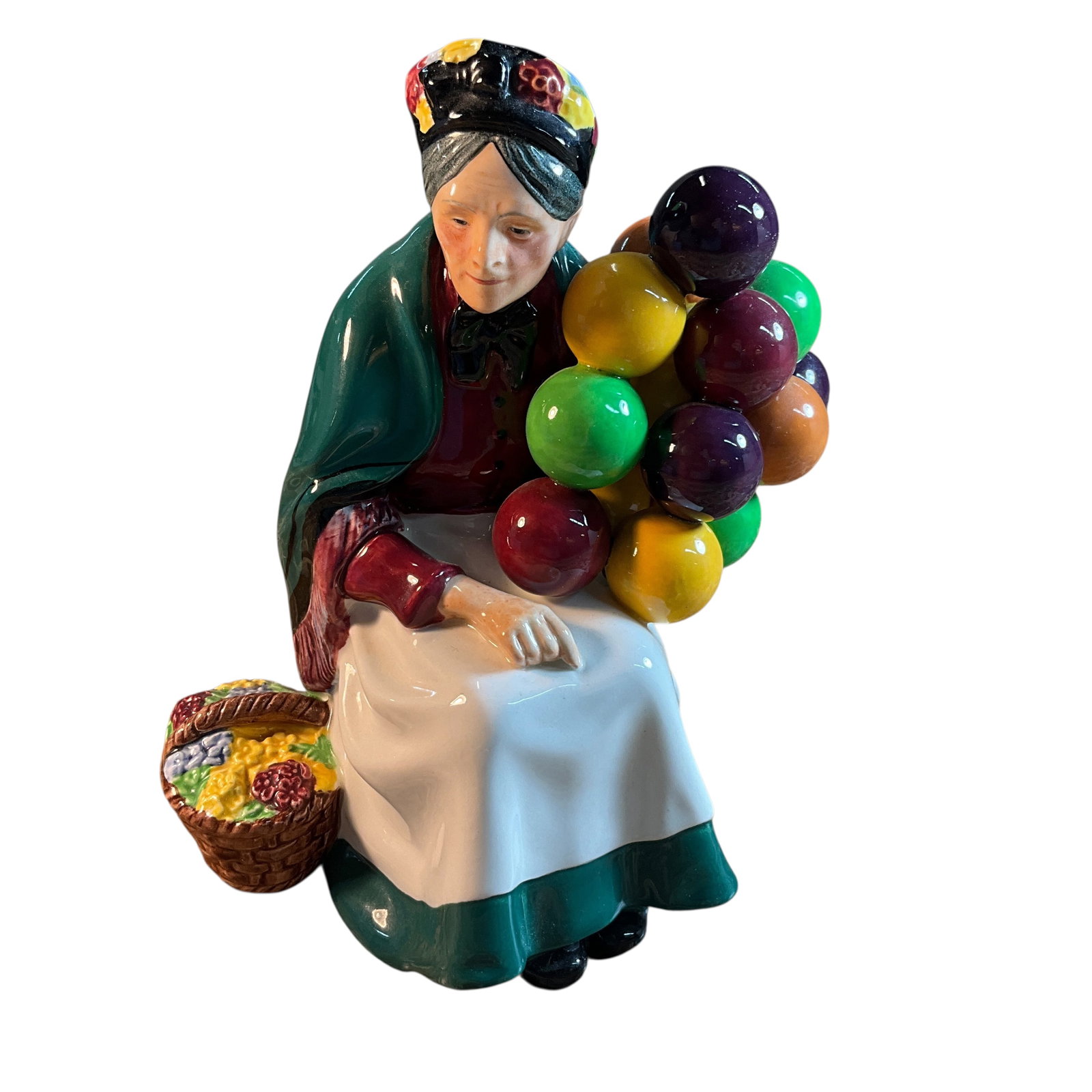 Royal Doulton Old Balloon Seller: Royal Doulton Old Balloon Seller, designed by Leslie Harradine and issued 1929-1998. Approx. 7.5" high.
