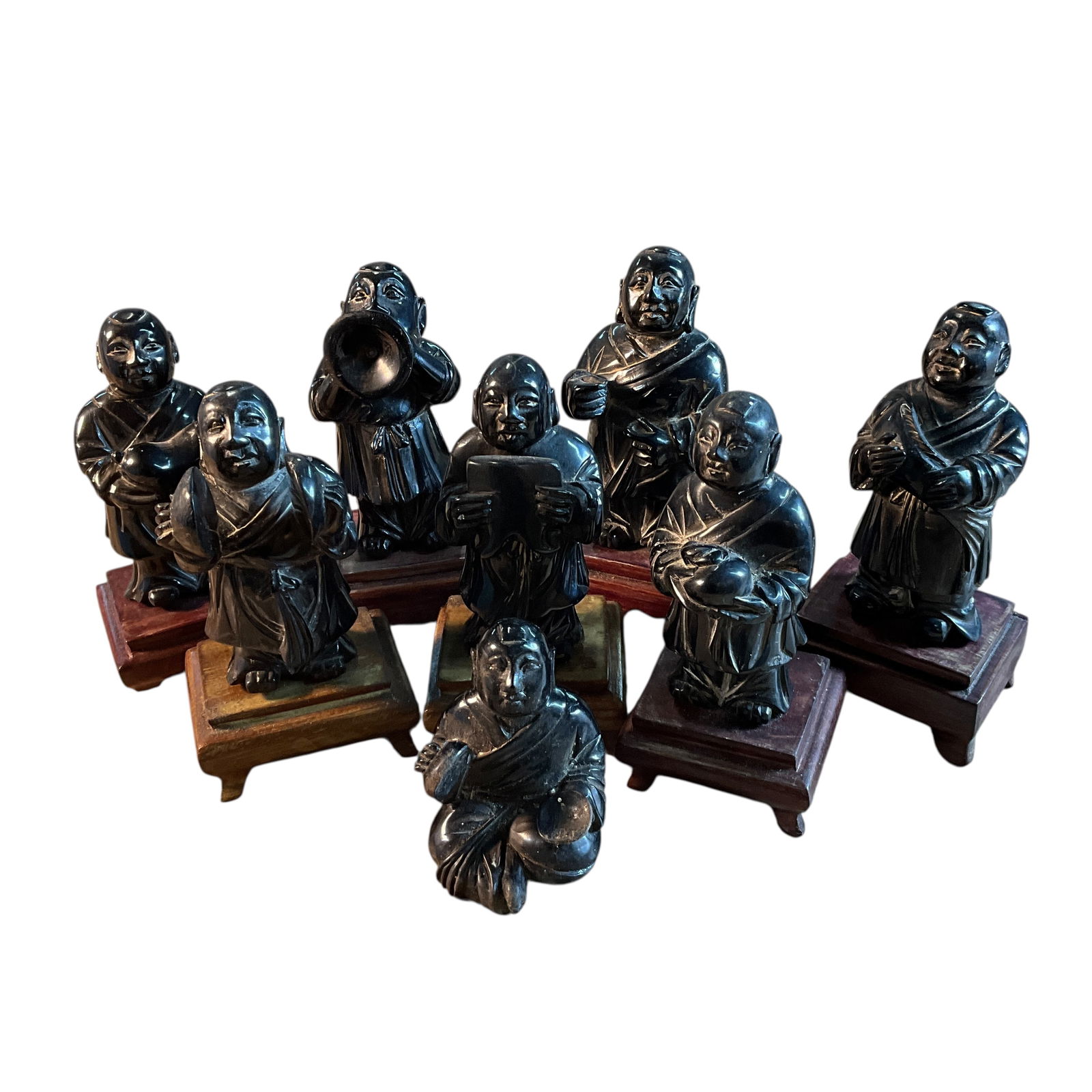 Group of Eight Chinese Black Lacquer Figures: Group of Eight Chinese Black Lacquer Figures. All but one have their original wooden stands, Some of the figures have various musical instruments, and some are holding offerings such as a fish and a p