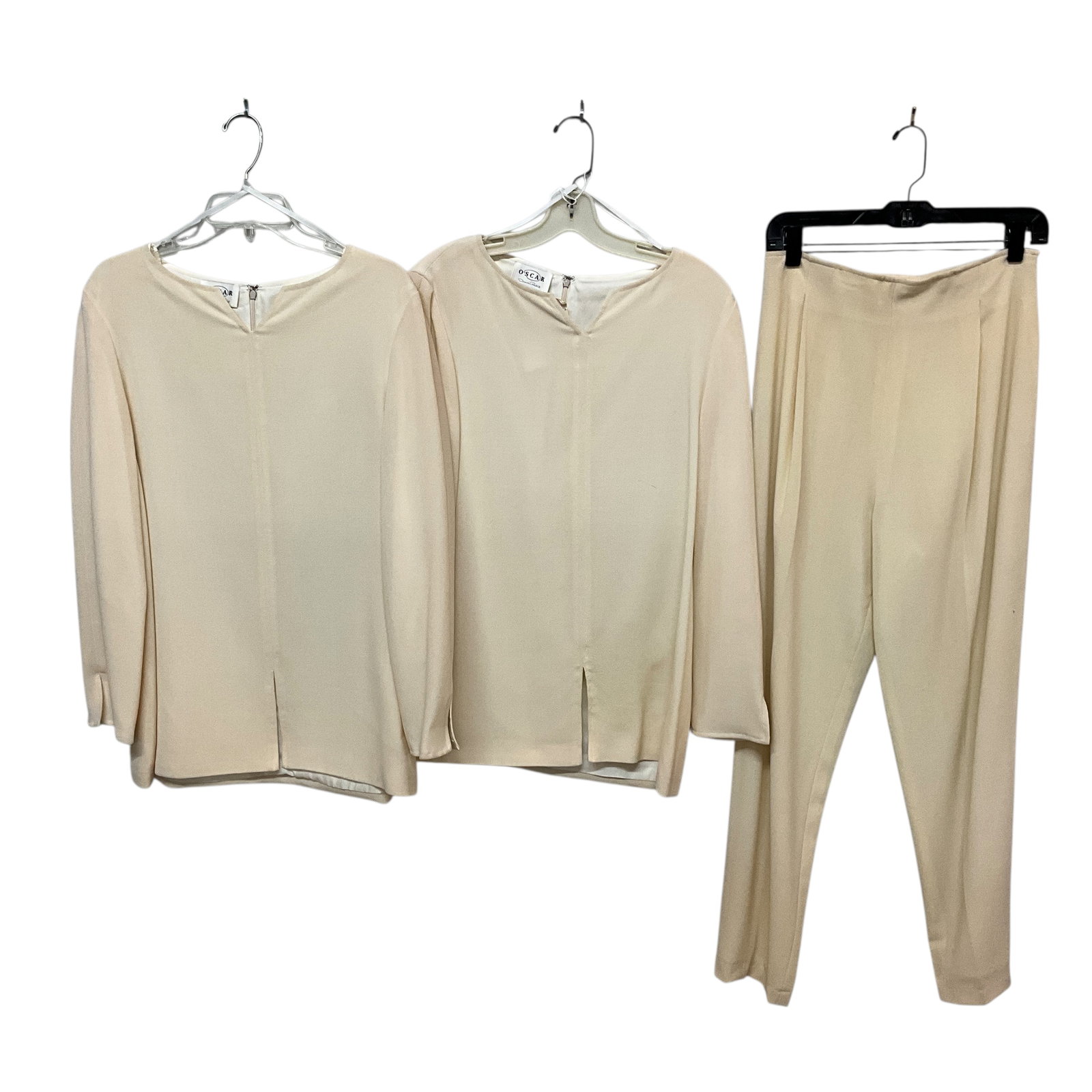 Vintage Oscar De La Renta: Two Tunics and a pair of matching easy wear trousers. Tunics are sizes 10 and 12. Light spots on the front of the trousers, please see photos.