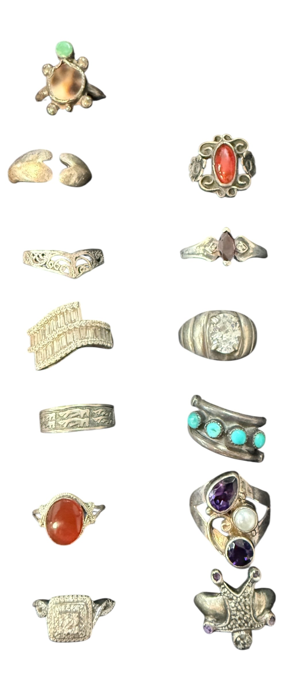 Vintage Rings: This is a group of 13 rings, each with a different design. Some are shaped like animals or butterflies, while others have colorful stones like turquoise, red, purple, and white. A few are plain metal