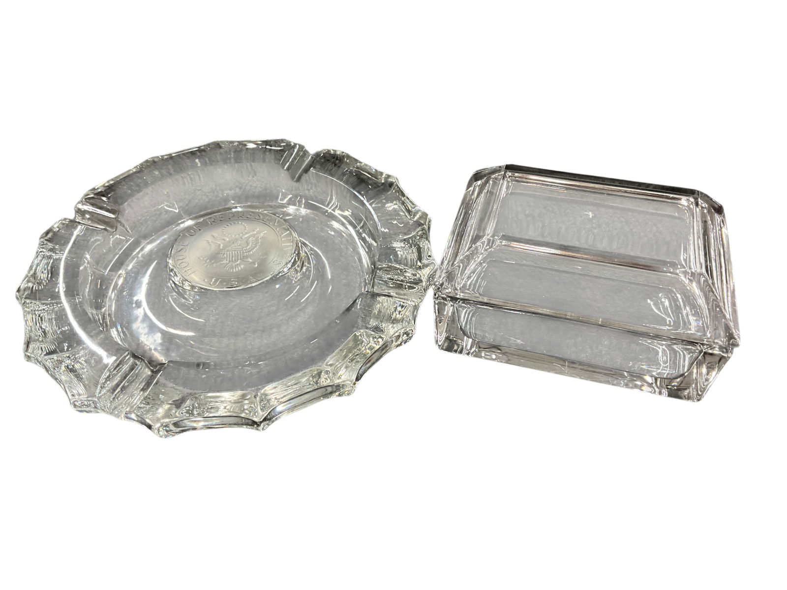 US House of Representatives Glass Ashtray & Cigarette Box.: US House of Representatives Glass Ashtray & Cigarette Box. An 8" circular ashtray with center embossed "US House of Representatives," with an unmarked glass cigarette box.