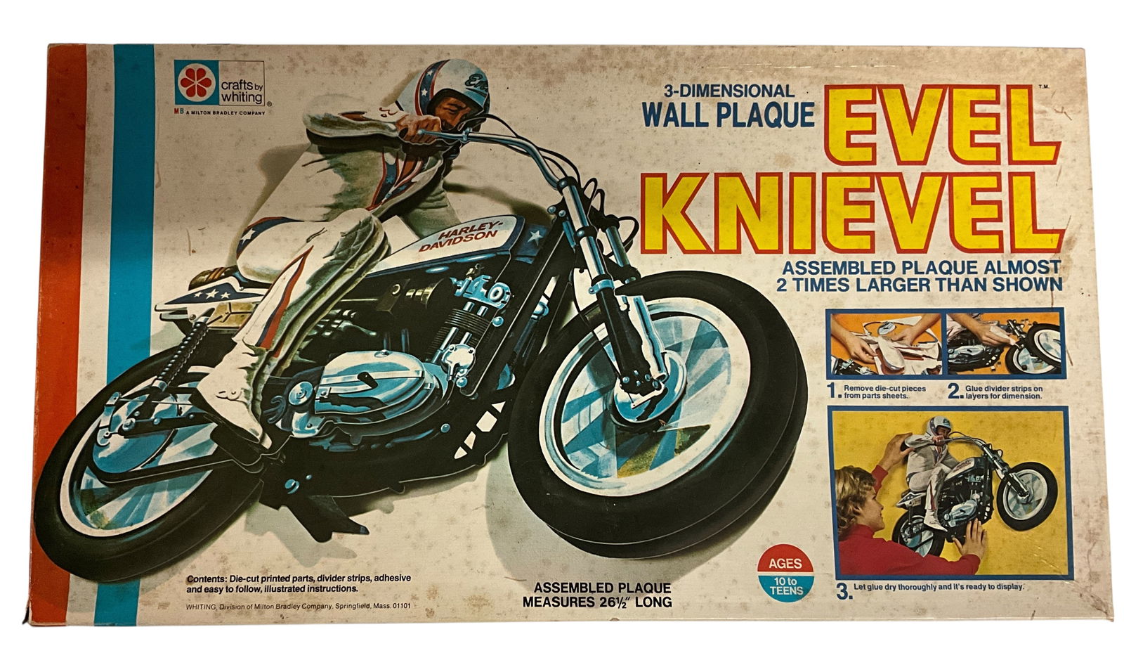 Evel Knievel 3 Dimensional Wall Plaque, in Original Box: Evel Knievel 3 Dimensional Wall Plaque, in Original Box. Unassembled- requires gluing cardboard sections together. This appears to be complete and never assembled.