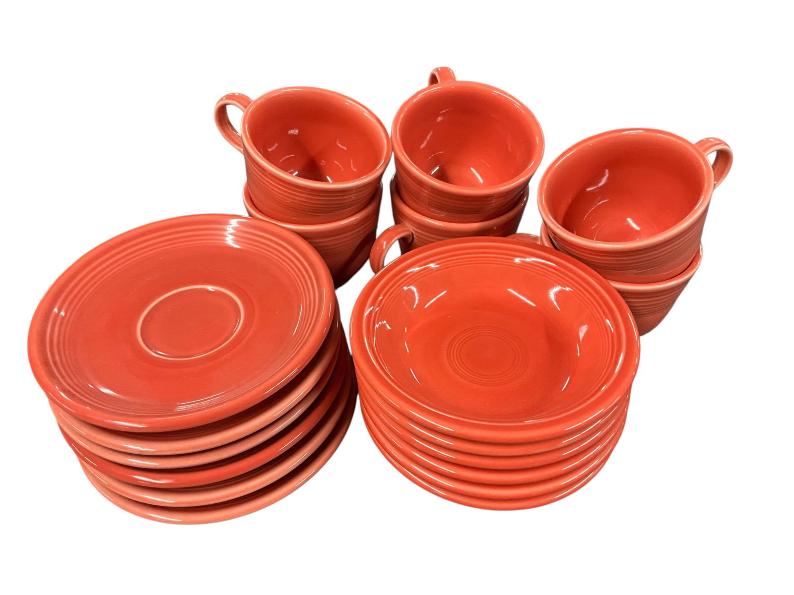 Fiestaware Grouping, Persimmon Colorway: Fiestaware Grouping, Persimmon Colorway. The Persimmon colorway was introduced in 1989, and has since been retired. This group consists of six cups and saucers, and six 5" sauce dishes. No noted