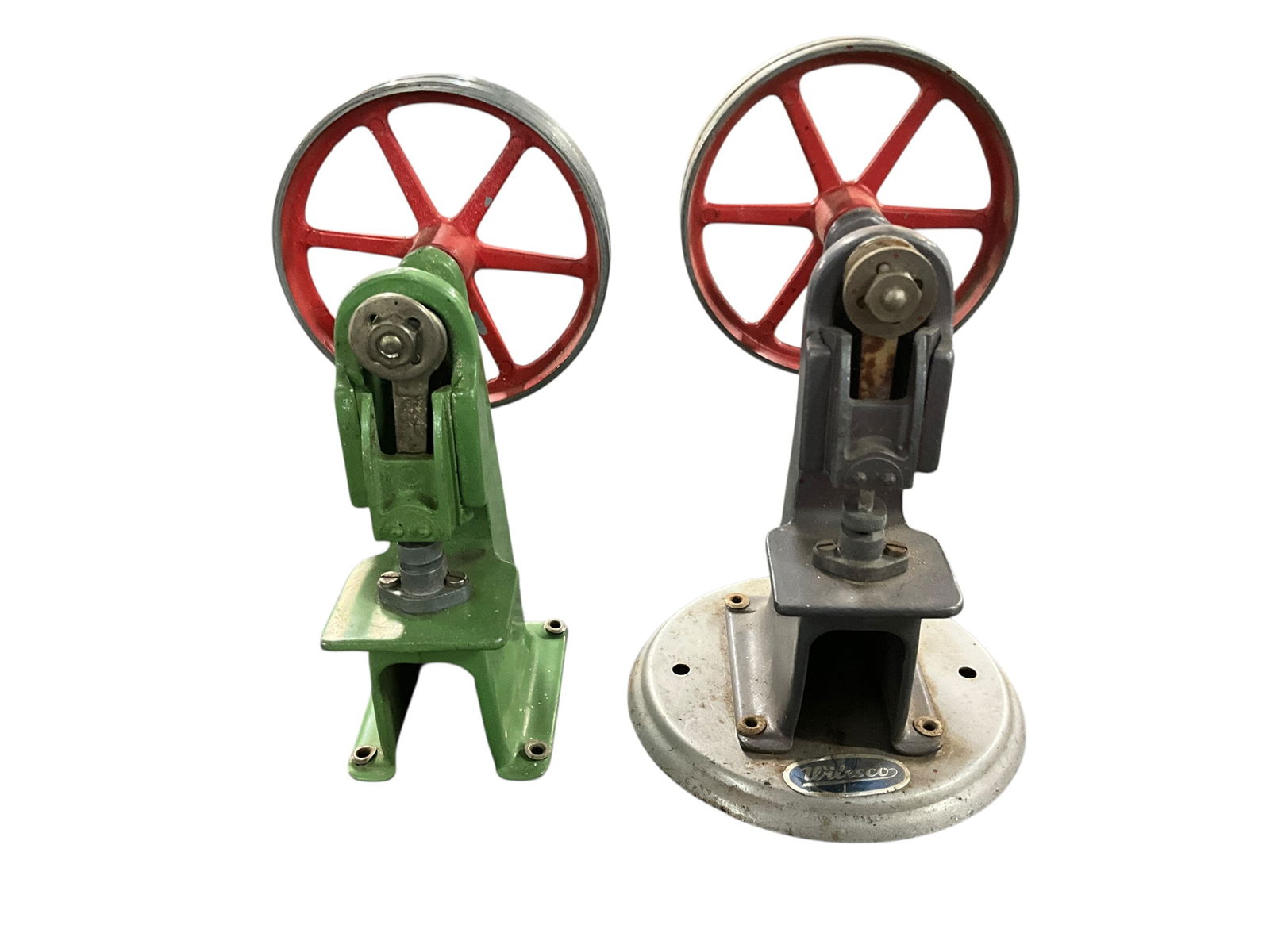 Wilesco Toy Model Punch Presses.: Wilesco Toy Model Punch Presses. One is missing its circular base. Miniature tools which run off the Power Take of from a model steam power plant, such as found in lots 144 and 149. Made by Wilesco