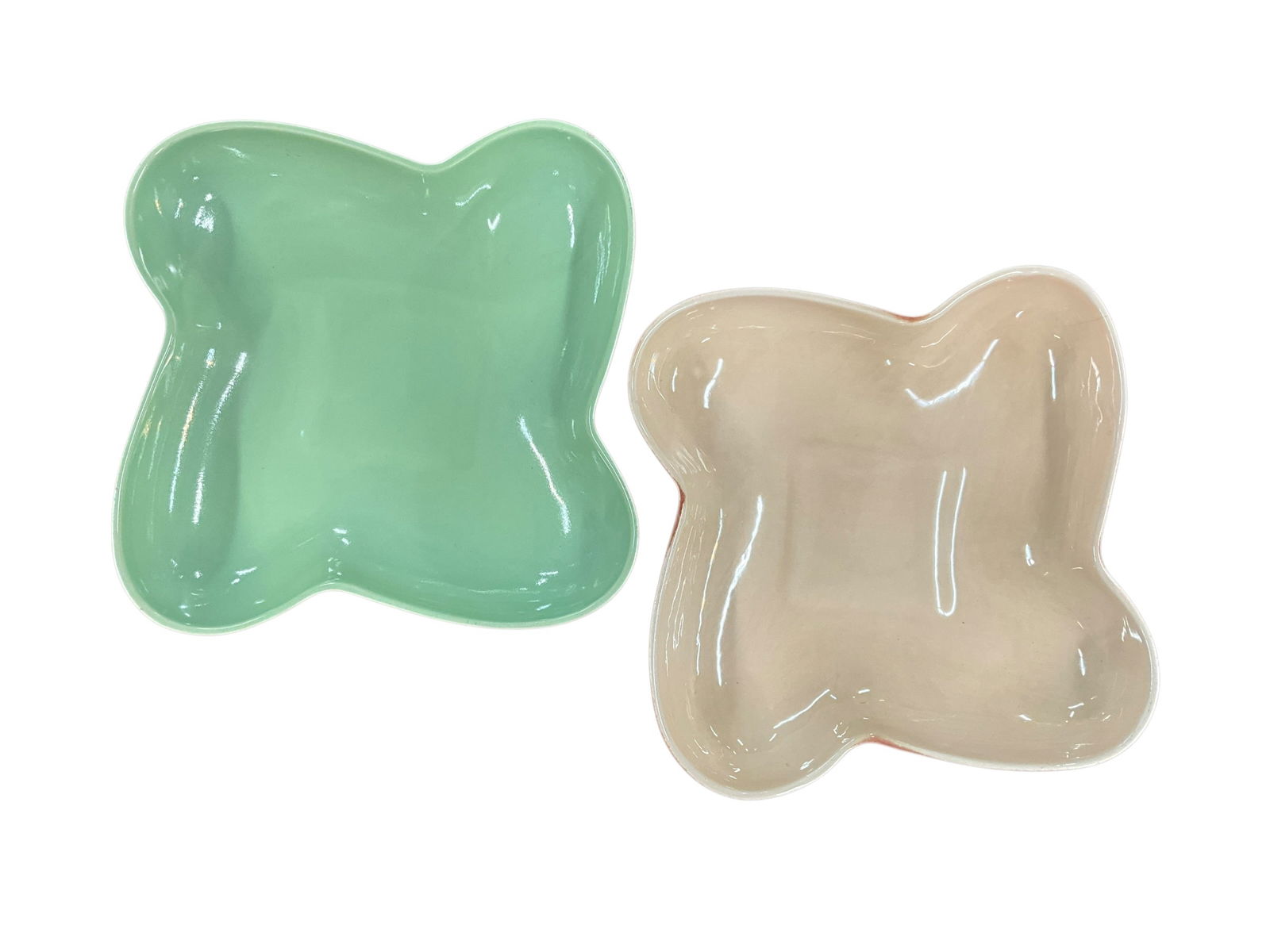 Pair of Red Wing Mid-Century Modern Console Bowls: Pair of Red Wing Mid-Century Modern Console Bowls. Asymmetric leaf form, both have reddish exterior glaze, with one having tan interior glaze, and one in sage green. Each is approx. 2" high, and 9.5"