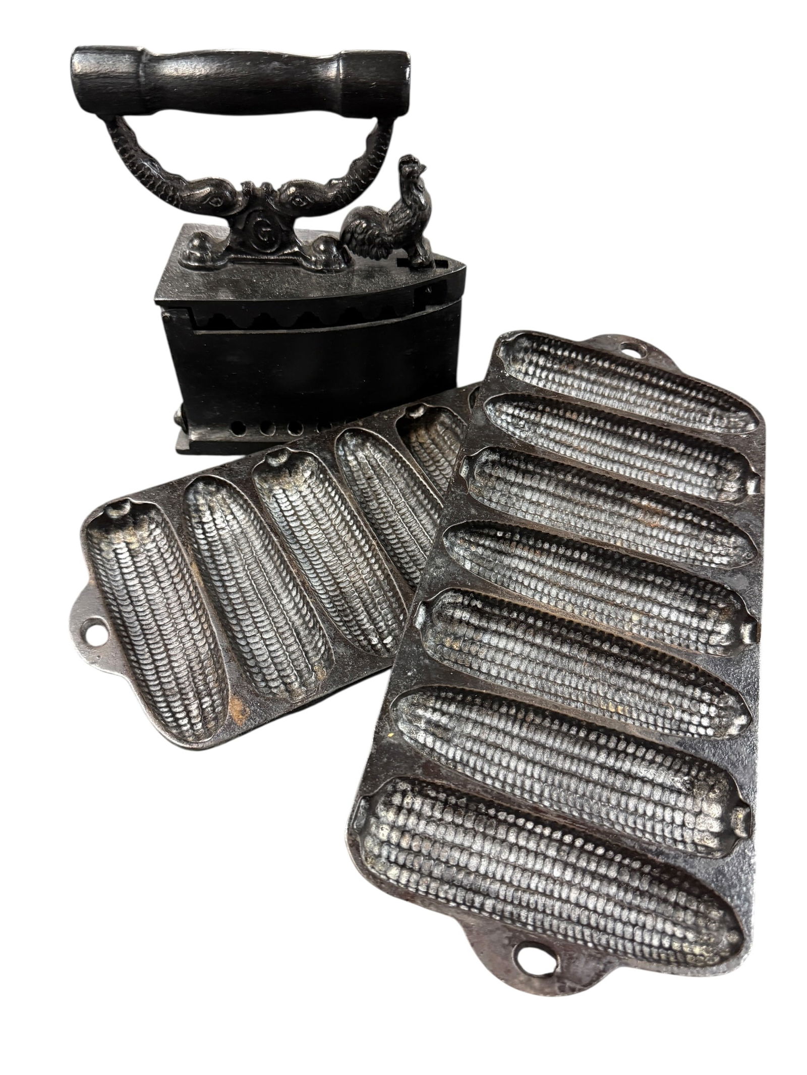 Pair of Wagner Cornbread pans, German Coal Iron: Pair of Wagner Cornbread pans, German Coal Iron. A pair of marked Wagner Ware cornbread pans, and a coal iron with a rooster shaped latch, marked "Made in Germany." All pieces have been spray painted