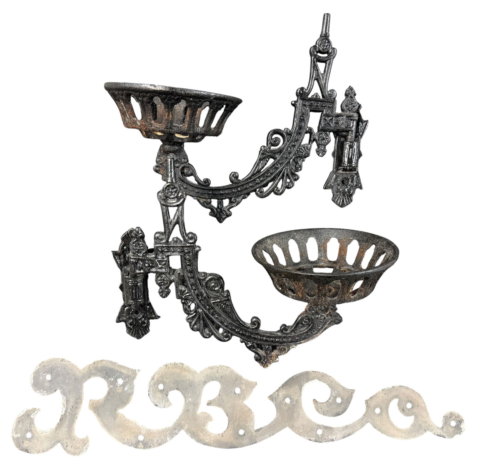 Pair of Victorian Cast Iron Lamp Brackets, "RB Co" wall sign.: Pair of Victorian Cast Iron Lamp Brackets, with wall socket hangers. Black painted cast iron, with some rust. Also an aluminum wall sign that spells out "RB Co" in script- interestingly, this is made