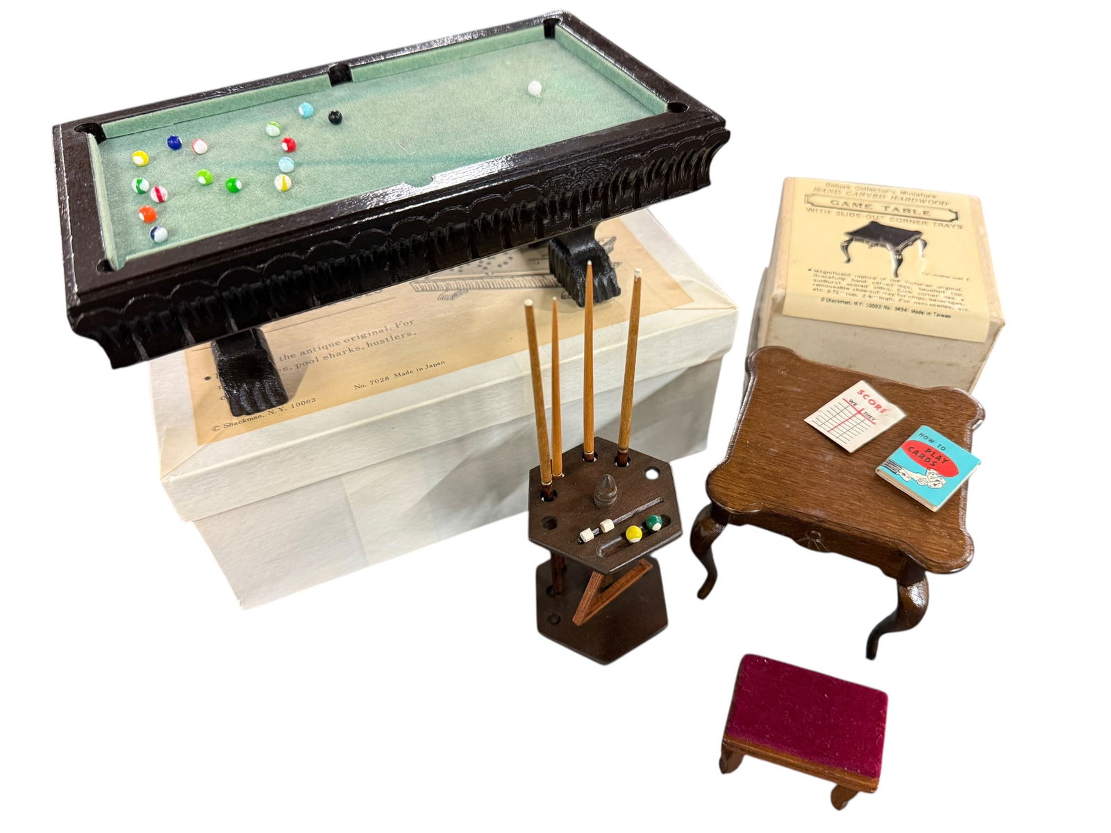 1970's-80's Shackman Dollhouse Furniture: 1970's-80's Shackman or Price Doll House Furniture. Four pieces, made in Japan or Taiwan, two in original boxes. A pool table, a game table, an upholstered stool, and a pool cue rack.