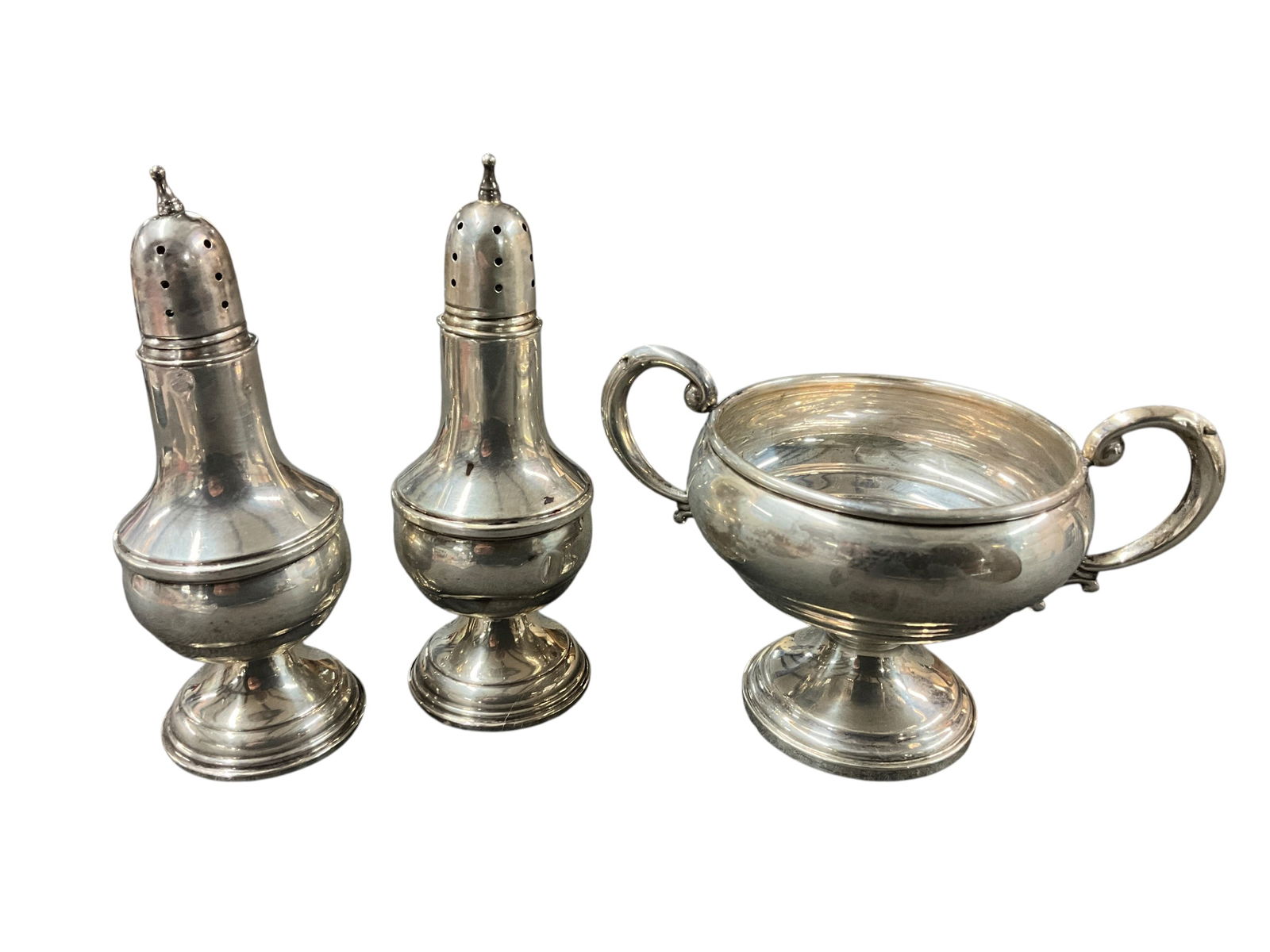 Weighted Sterling Items: Weighted Sterling Items- A pair of Wallace Salt & Pepper shakers, and a Mueck-Cary two handled sugar bowl