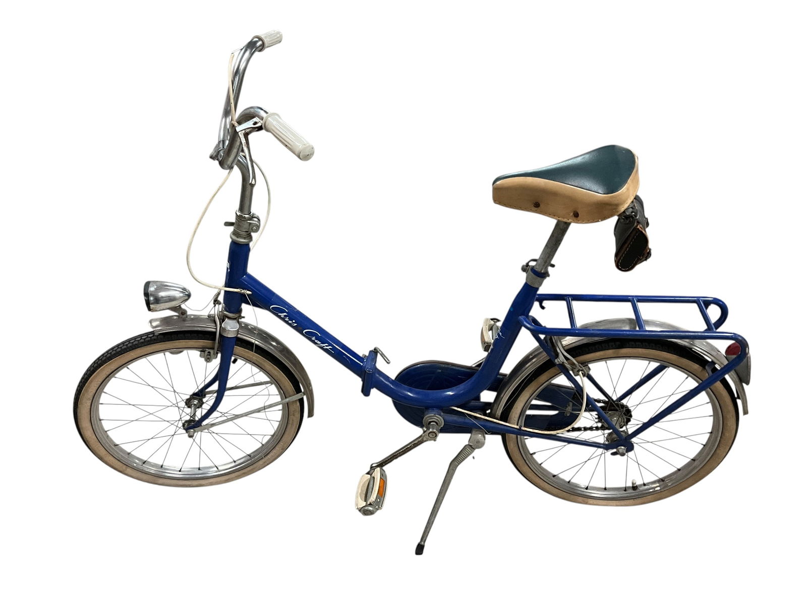 Chris-Craft Cabin Boy Folding Bicycle: Chris-Craft Cabin Boy Folding Bicycle. Made to carry aboard motor yachts for in-port use. With 20" wheels, luggage rack, and head and tail lights powered by a wheel mounted generator. Tires are flat