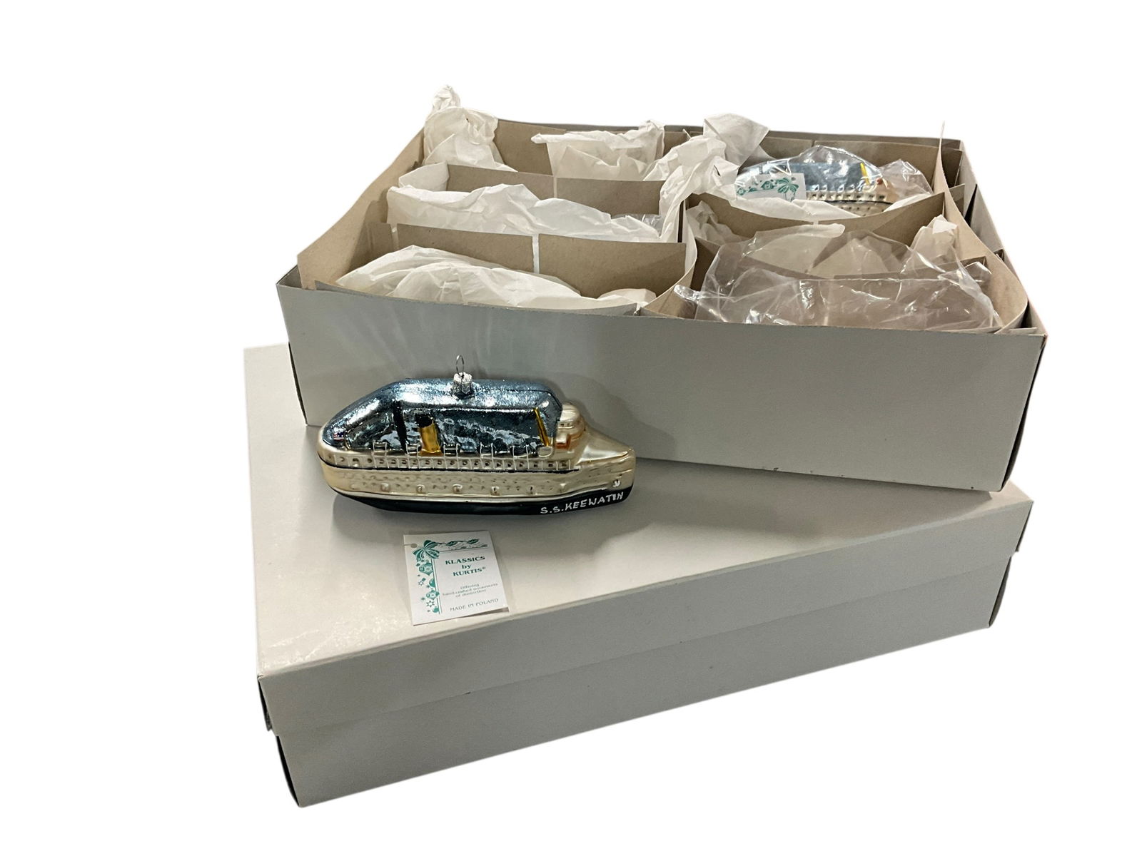 SS Keewatin Blown Glass Ornaments: SS Keewatin Blown Glass Ornaments. Nine in total in two boxes- new old stock. Blown glass Christmas ornaments, made in Poland, and inscribed, "1967 to 2012, Douglas, Mich." Each ornament is approx.