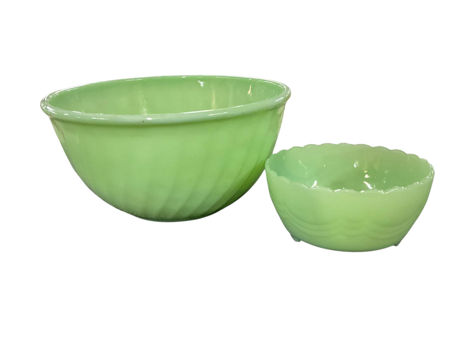 Fire King Swirl Pattern Bowls: Fire King Swirl Pattern Bowls. One 9" mixing bowl, and one 5.25" footed bowl with scalloped edges.