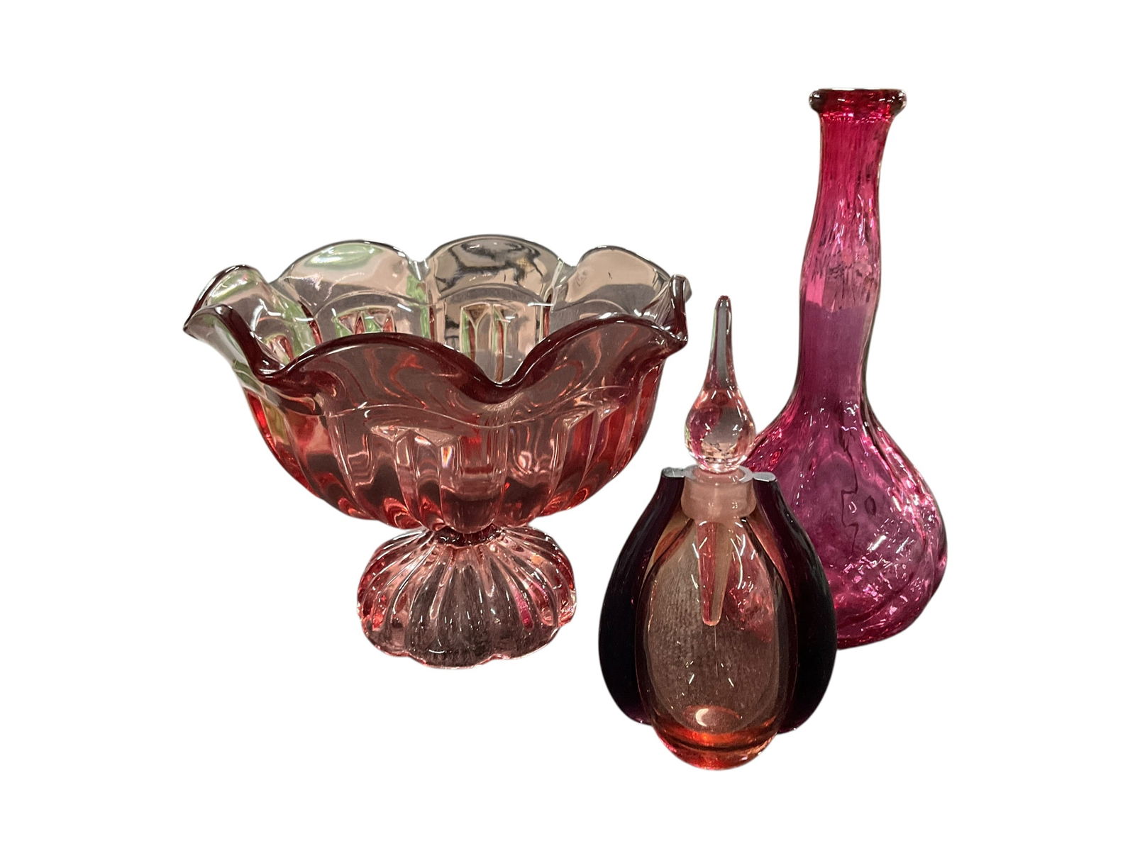 Cranberry Glass Lot: Cranberry Lot. A footed 7" bowl with ruffled rim, a 9" bud vase, and an Art Deco style perfume with applied side strapping.