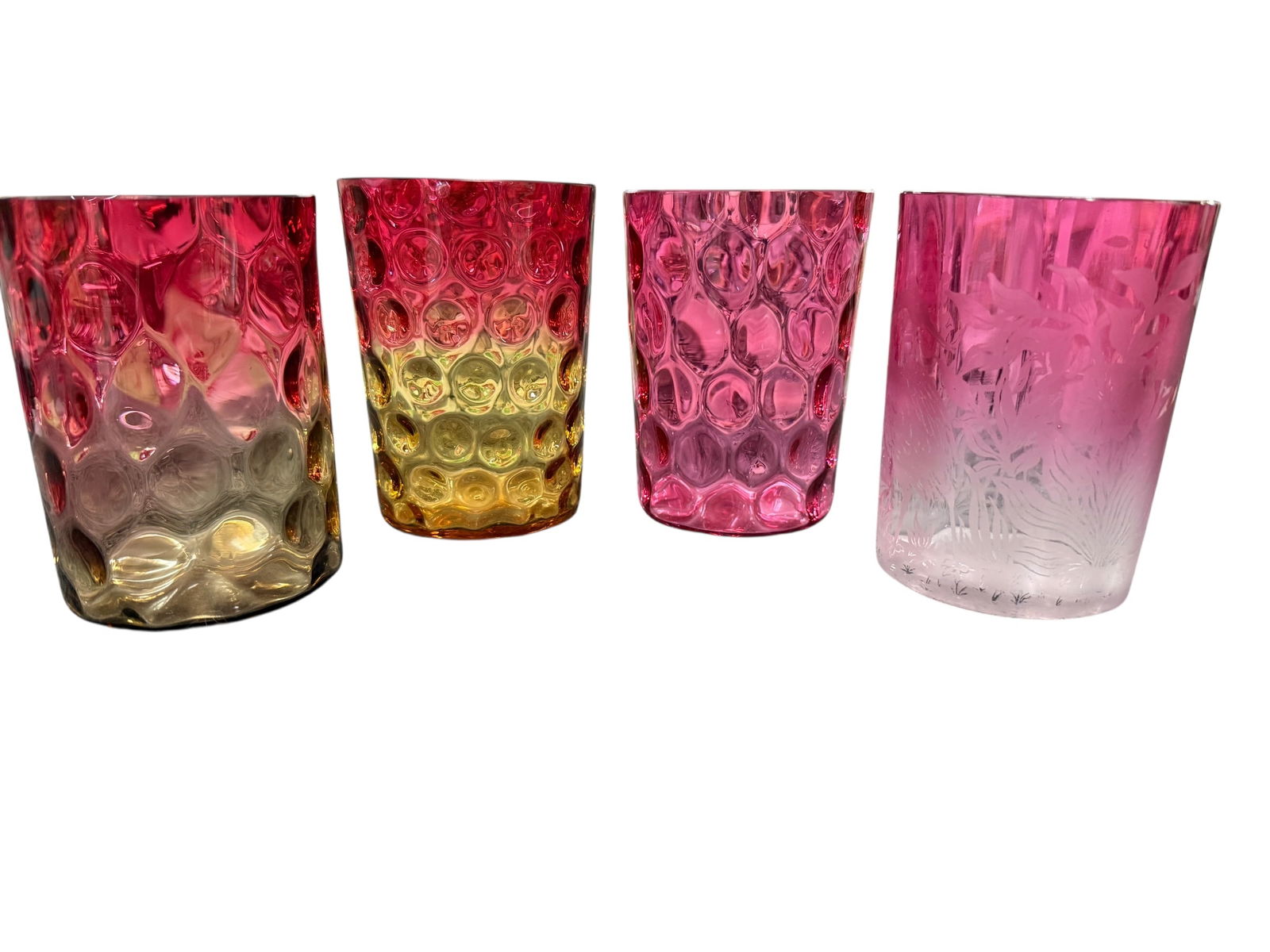 Victorian Era Glassware: Victorian Era Glassware. A Pair of Bavarian Theresienthal tumblers in the "Feuilles" (Leaves) pattern, An Amberina tumbler with inverted thumbprint pattern, likely Hobbs, and a cranberry tumbler,