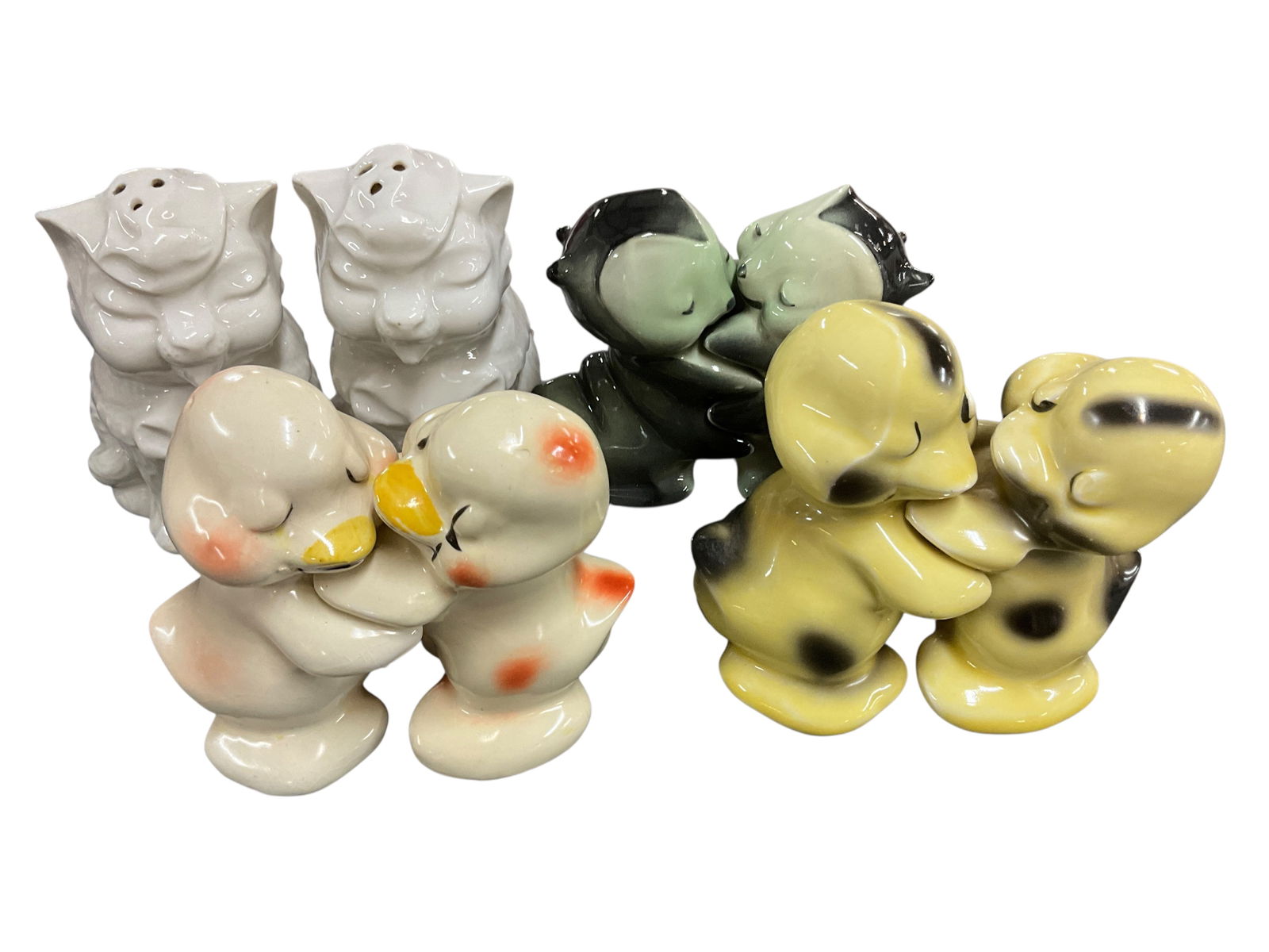Van Telligen "Huggies" Salt & Pepper: Van Tellingen "Huggies" Salt & Pepper. Four sets of salt & pepper shakers, three of which are Van Telligen Huggies. One set is the popular "Love Bugs" pattern, featuring two hugging caterpillars.