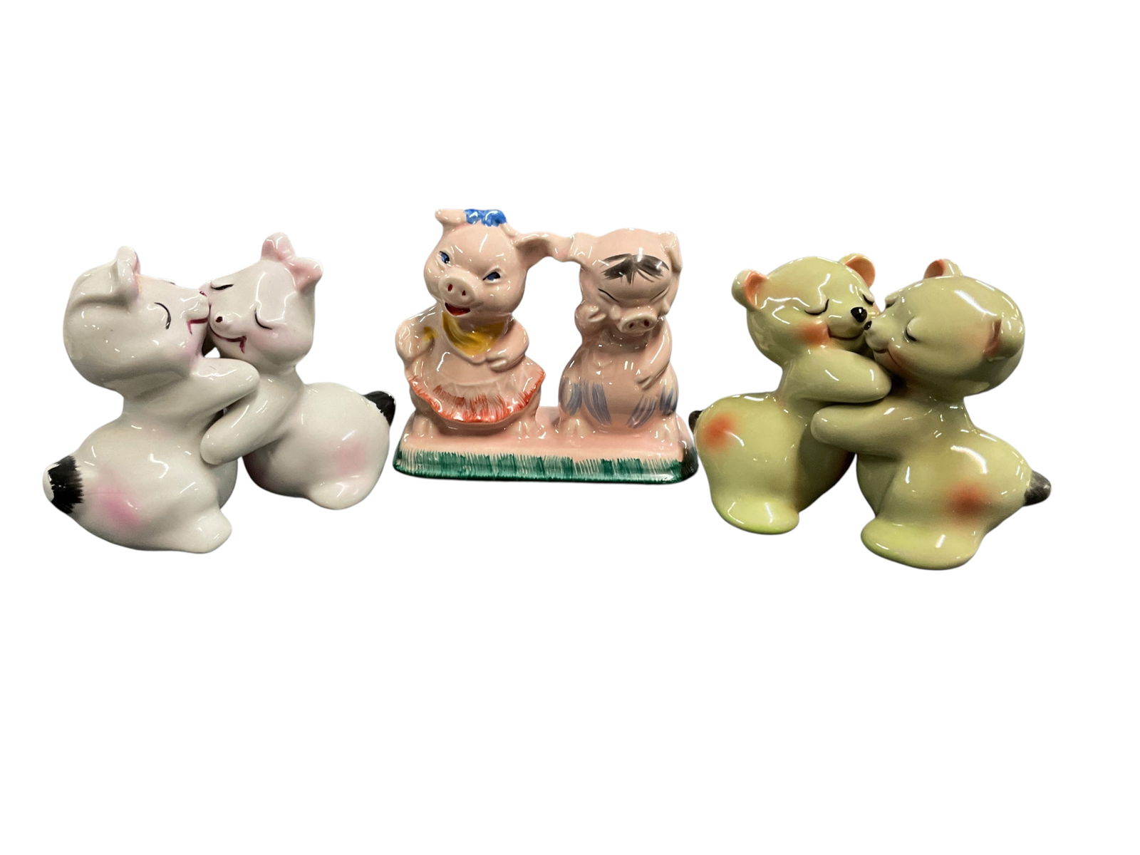 Van Tellingen, Miller Salt & Pepper Shakers: Van Tellingen, Miller Salt & Pepper Shakers. A pair of pigs, which share a common base, designed by Catharine Miller, and two pairs of Van Tellingen "Huggies" shaker sets.