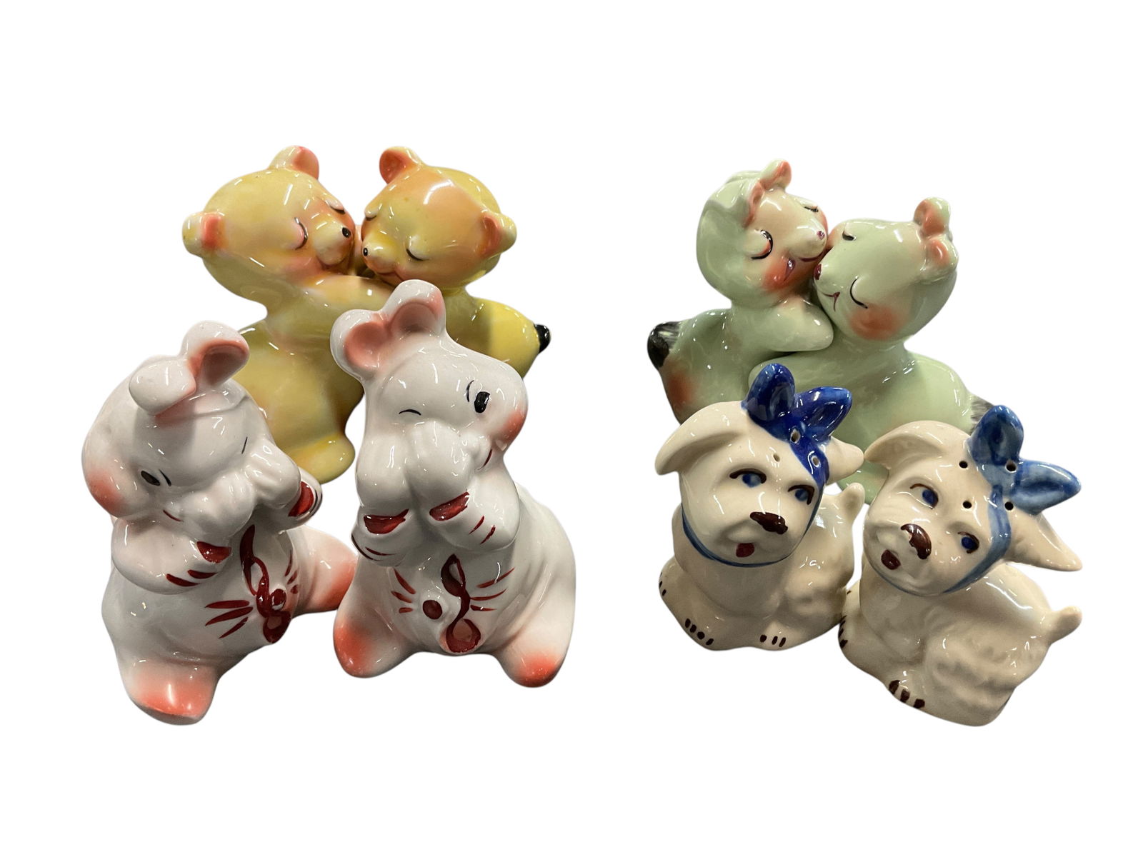 Vintage Van Telligen and Shawnee Pottery S&P: Collection of four vintage Van Tellingen shaker sets. Includes Peek-a-boo, Bunnies, Bears and a pair of Shawnee "Mugsy Dogs".