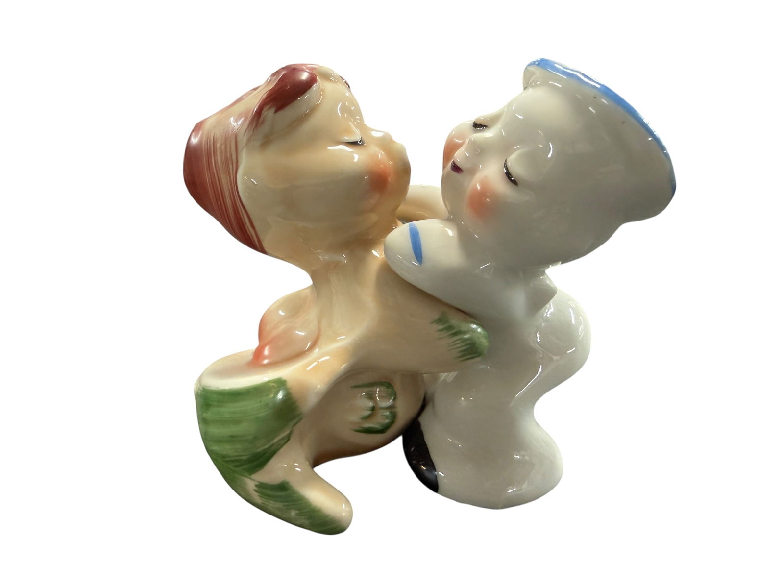 Vintage Van Tellingen-Huggy: This vintage set of 1950s Van Tellingen Salt & Pepper Shakers features a charming design of a hugging sailor and mermaid. Crafted from ceramic/porcelain, these shakers are a delightful addition to any
