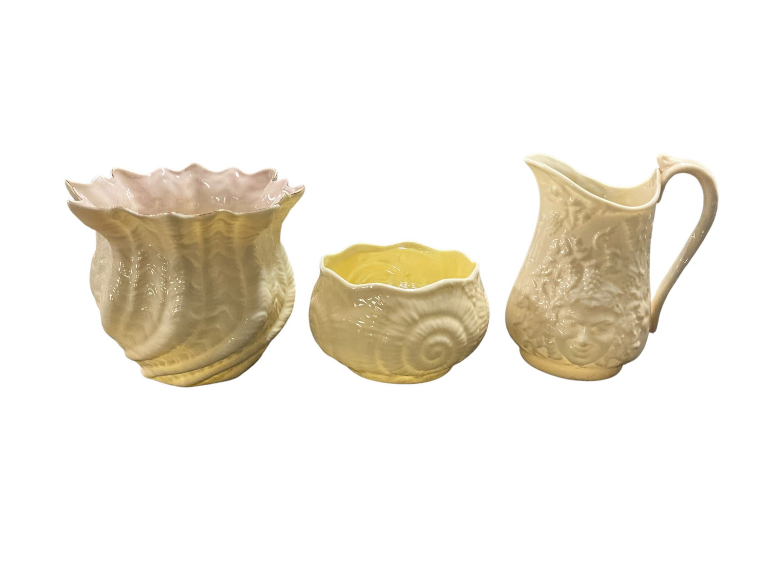 Collection of Belleek China: Bacchus Mask & Grape pitcher. Sugar bowl in the Neptune pattern. Vase in the Neptune Swirl pattern.