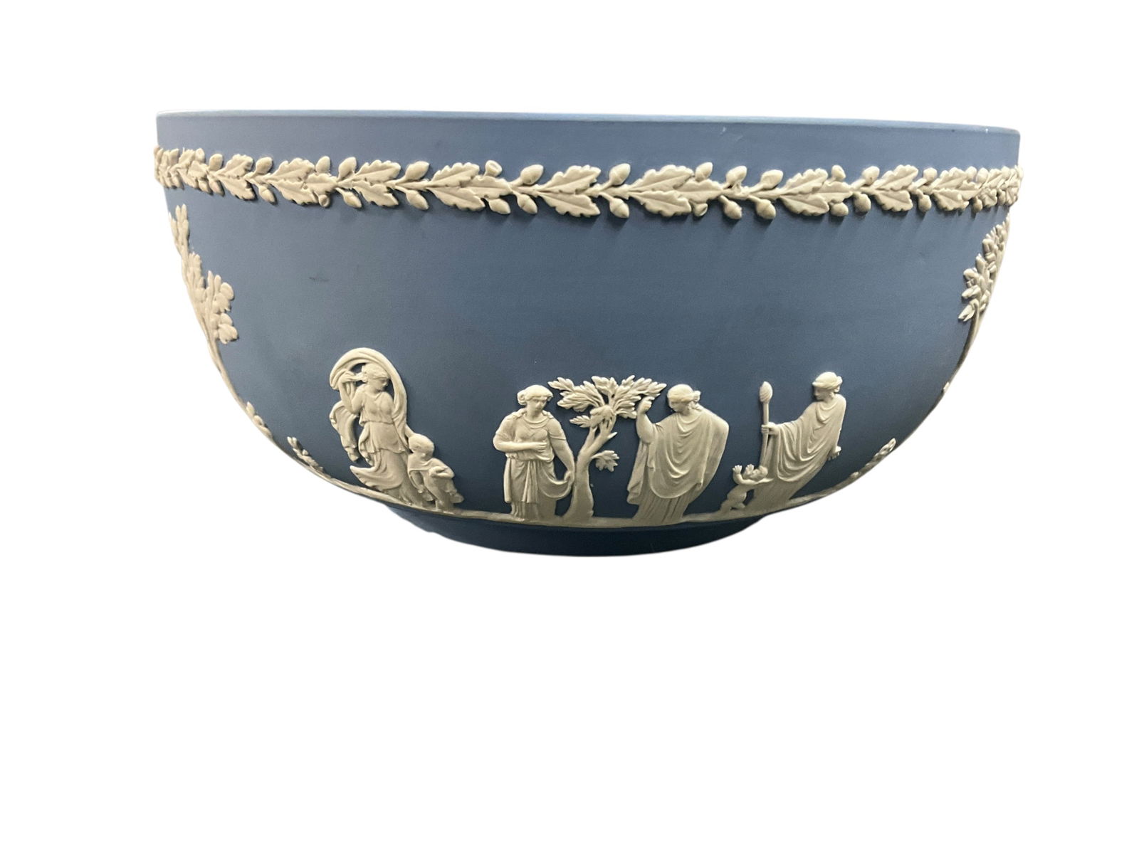 Wedgwood Bowl: Vintage Wedgwood Jasperware 8" Sacrifice Bowl is a beautifully crafted piece of Neoclassical stoneware, originating from England. The round bowl features raised relief and decorative elements inspired