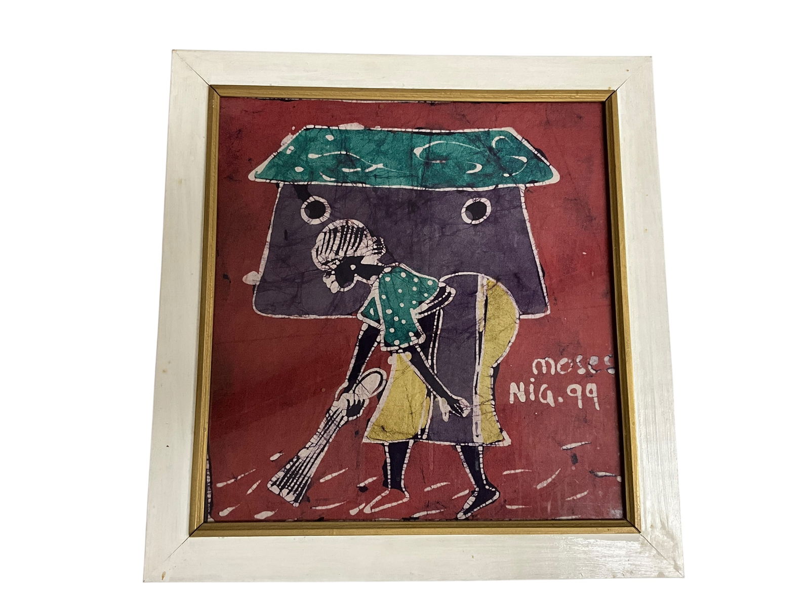 Framed African Batik Art: Lovely Batik painting on fabric. Image is of a woman sweeping in front of a small home. Colors are bright and image is appealing. Signed by Moses of Nigeria "99".