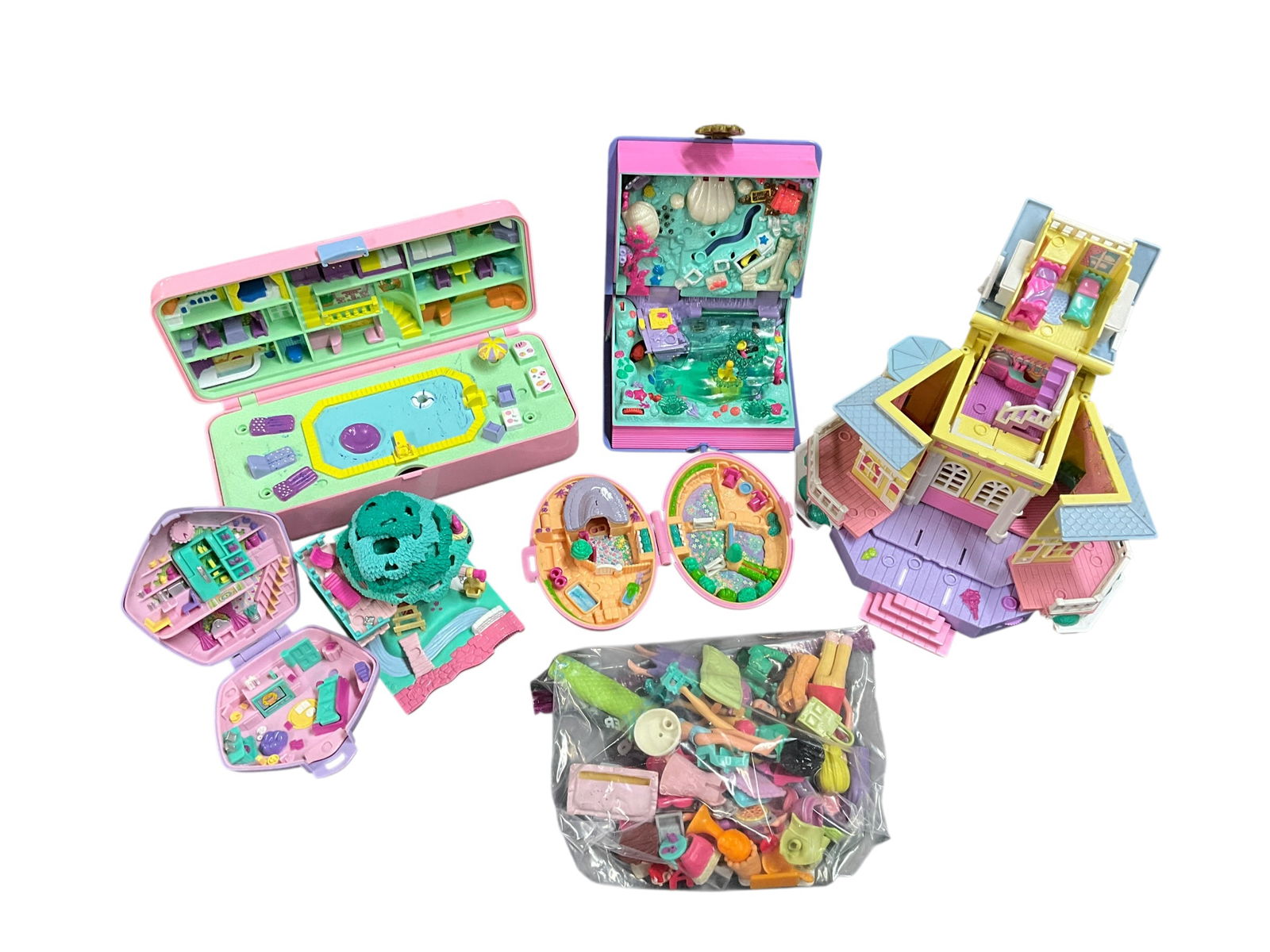 Vintage Polly Pocket Bluebird Pollyville Buildings: Lot of 5 Vintage 1990s Bluebird Polly Pocket buildings, a Pollyville tree house playset and a group of accessories. Includes a 1995 Pop Up Party Playhouse, Sparkling Mermaid Adventure Storybook, and a