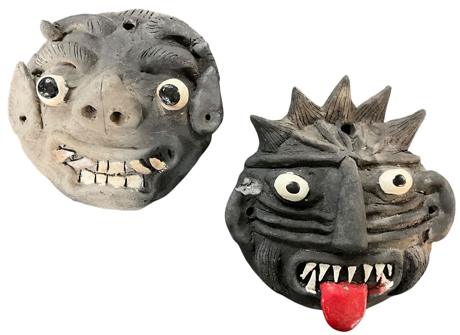 Two Ceramic Monster Masks, Southwestern China: Ceramic Monster Masks, Southwestern China. Two vividly sculpted and painted masks, measuring approx. 5" to 6" high. From the collection of the Kruizenga Art Museum at Hope College, Holland, MI.