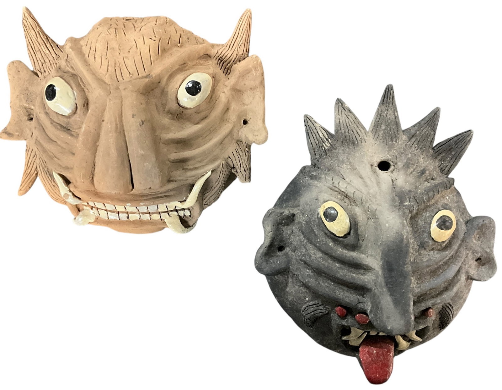 Two Ceramic Monster Masks, Southwestern China: Ceramic Monster Masks, Southwestern China. Two vividly sculpted and painted masks, measuring approx. 5" to 6" high. From the collection of the Kruizenga Art Museum at Hope College, Holland, MI.