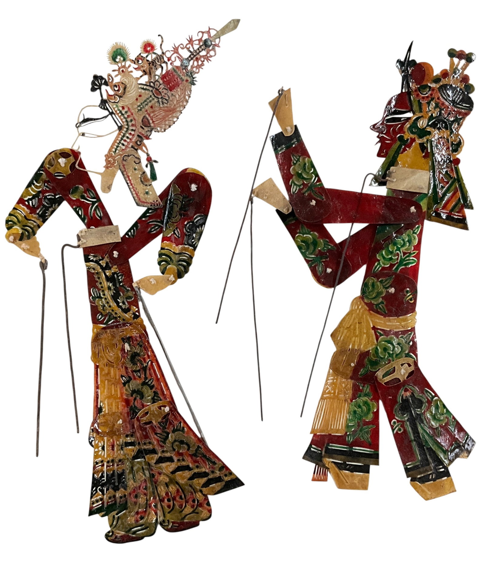 Pair of Chinese Shadow Puppets: Pair of Chinese Shadow Puppets. Measuring approx. 13" tall, these colorful and intricately detailed puppets represent a traditional Chinese art form dating back over a thousand years. This pair is com