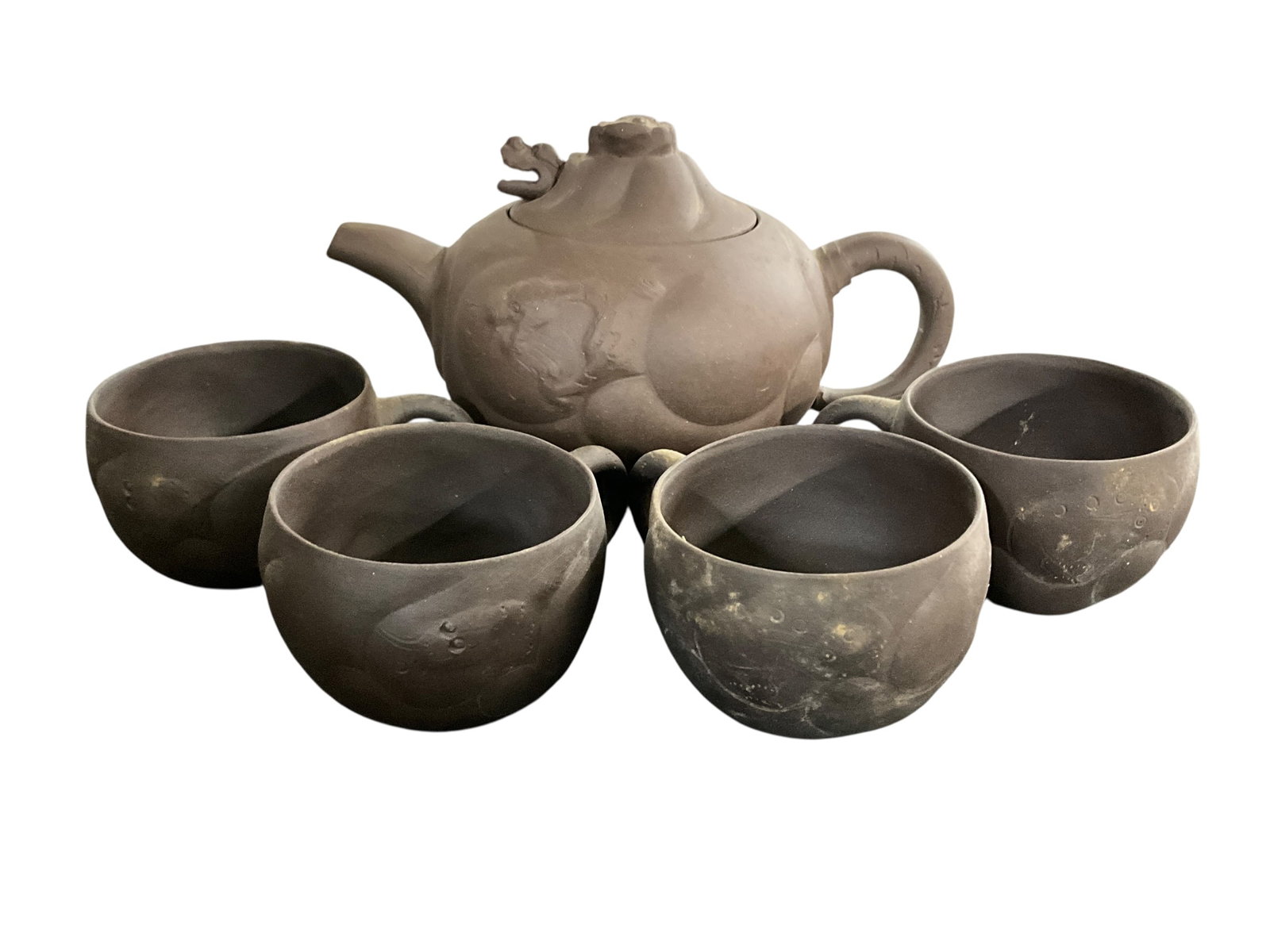 Chinese Yixing Tea Set: Chinese Yixing Tea Set- Also known as Zisha Ware, crafted from unglazed purple Yixing clay. The porous and unglazed clay is designed to absorb tea flavors over time to enhance future brews. Pot is app