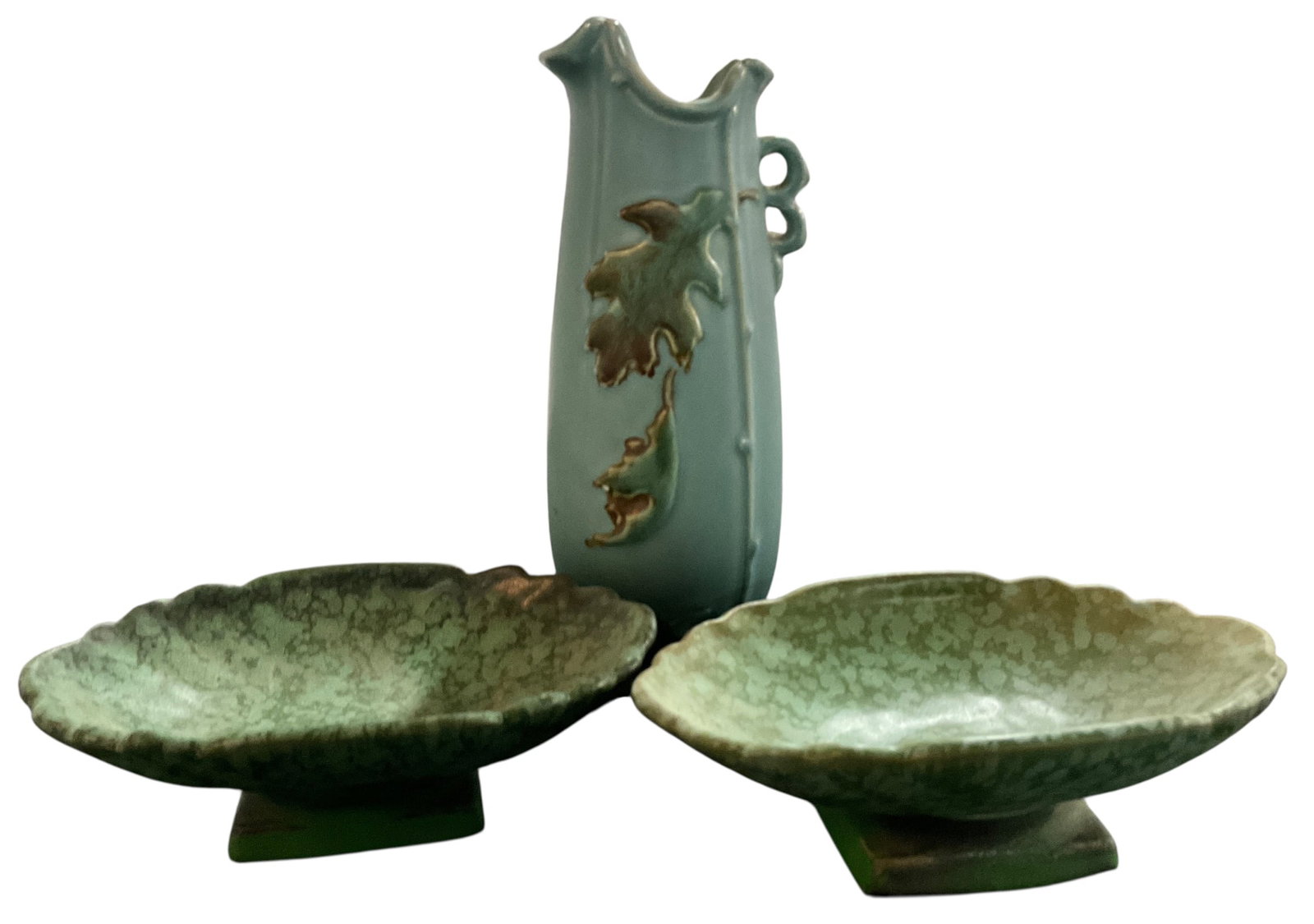 Three Weller Art Pottery Items: Three Weller Art Pottery Items. An 8" vase in the 1930's Oak Leaf Pattern, and a pair of Weller Sydonia 6.5" footed soap dishes from the 1920's.