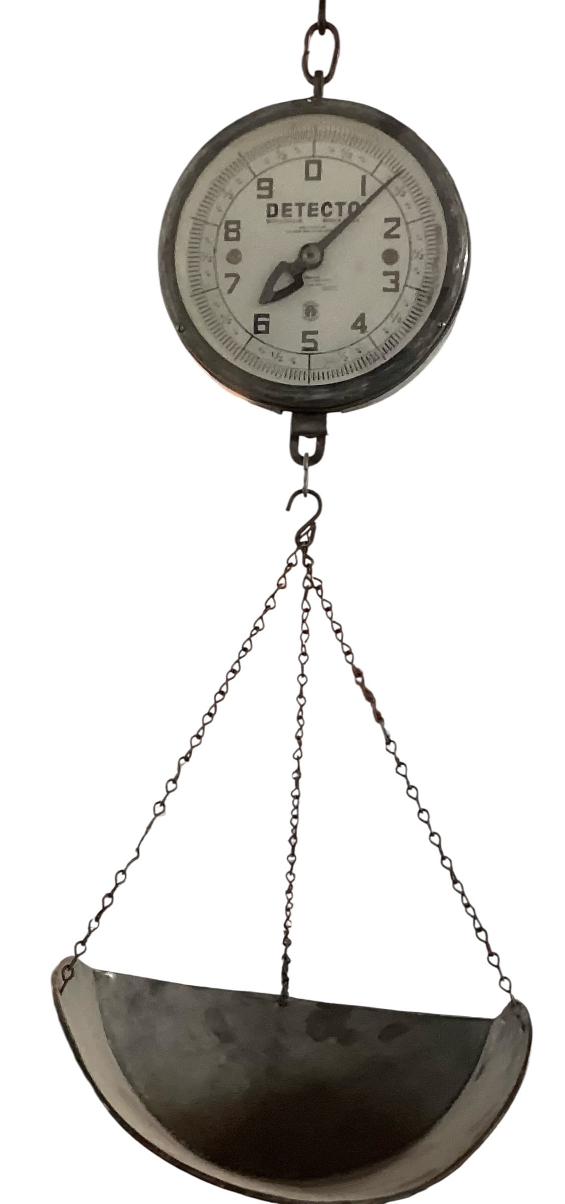 Vintage Detecto Hanging Produce Scale with Metal Scoop Tray: Vintage Detecto hanging produce scale featuring circular analog dial marked Detecto Scales Inc., Brooklyn, N.Y., U.S.A. with suspended metal scoop tray and hanging chain. Scale includes black metal ho