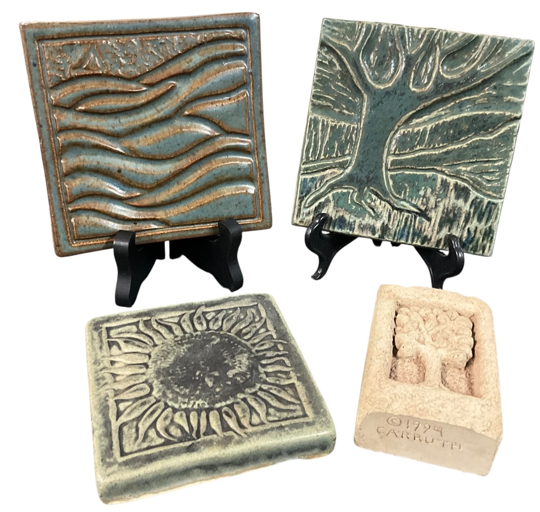 Art Pottery Tile Group incl. Fantastic Tiles, a signed Carruth Tile, & Whistling Frog Tile (4 pcs): Group of four art pottery tiles featuring a variety of relief designs and glazes. Includes a 'Fantastic Tiles' example with stylized landscape and tree motifs, a Whistling Frog sunburst design tile, a