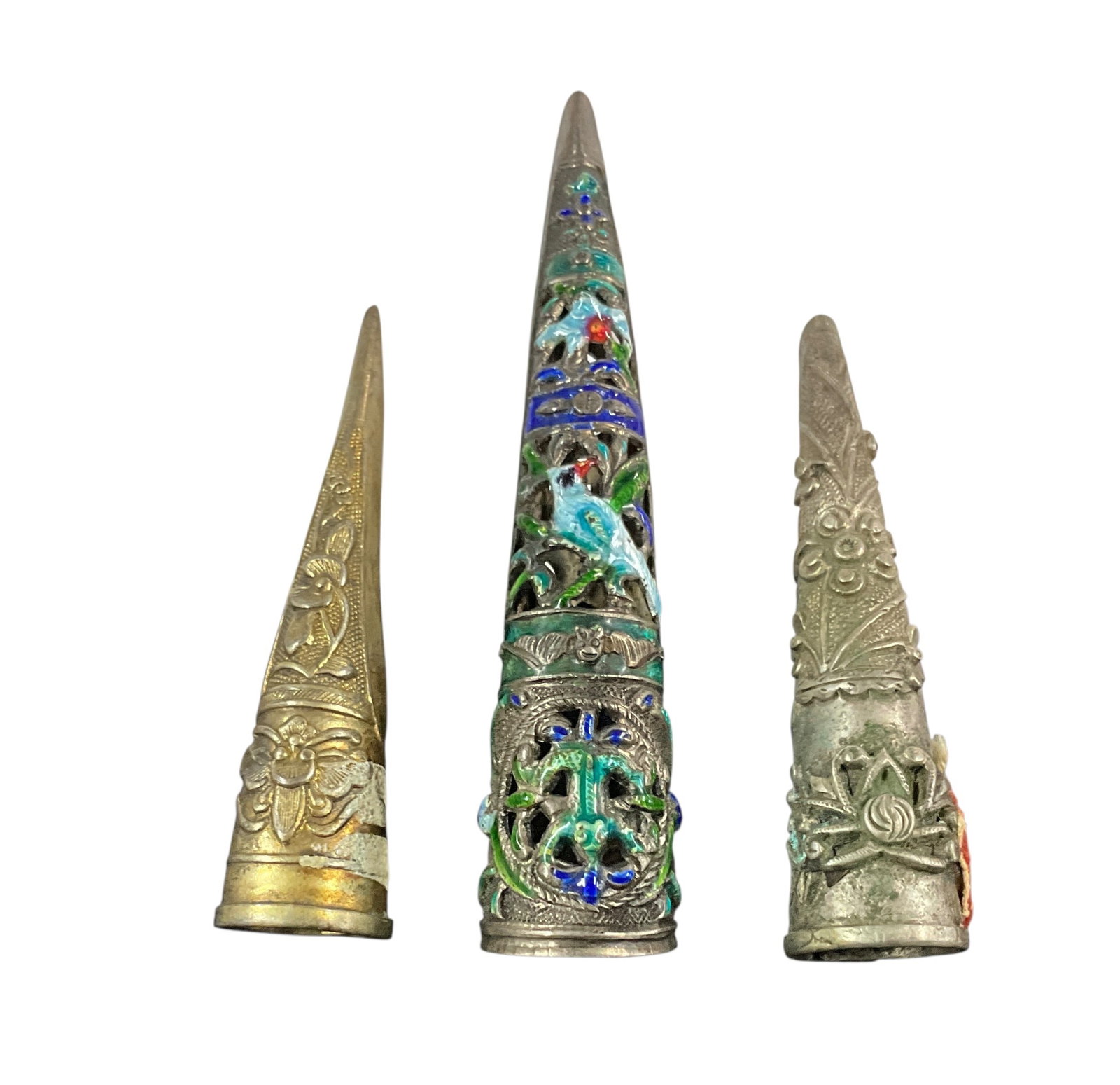 Antique Chinese Fingernail Guards with Enamel and RepoussÃ© Decoration (3 Pieces): Group of three antique Chinese fingernail guards, traditionally worn as status symbols to protect long nails. Includes one openwork example with colorful enamel decoration featuring birds and floral m