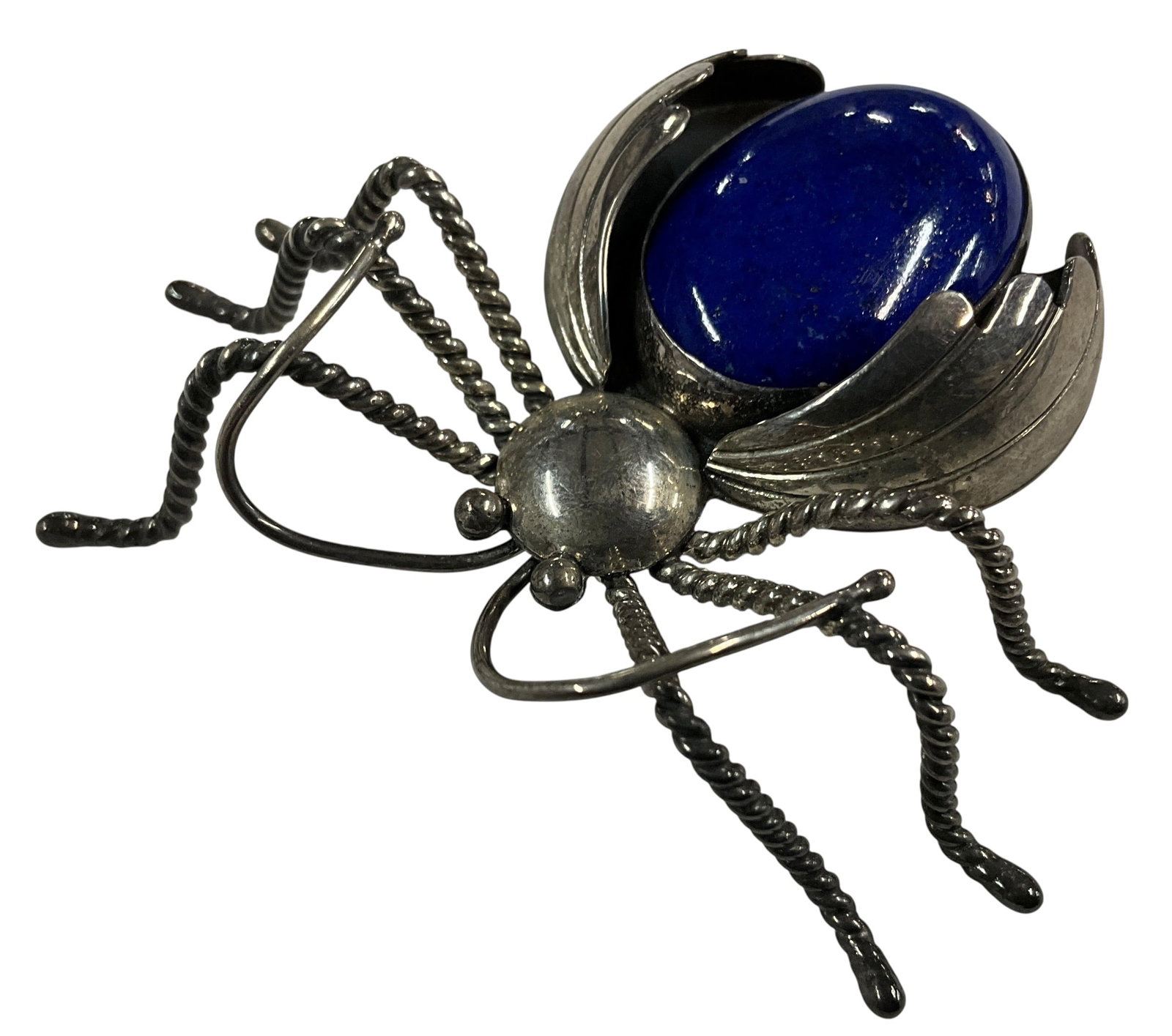 Vintage NAKAI Sterling Silver Spider Brooch with Lapis Lazuli Cabochon: Striking vintage sterling silver brooch in the form of a spider, set with a large oval lapis lazuli cabochon forming the body. The piece features detailed twisted wire legs and sculptural silverwork, 