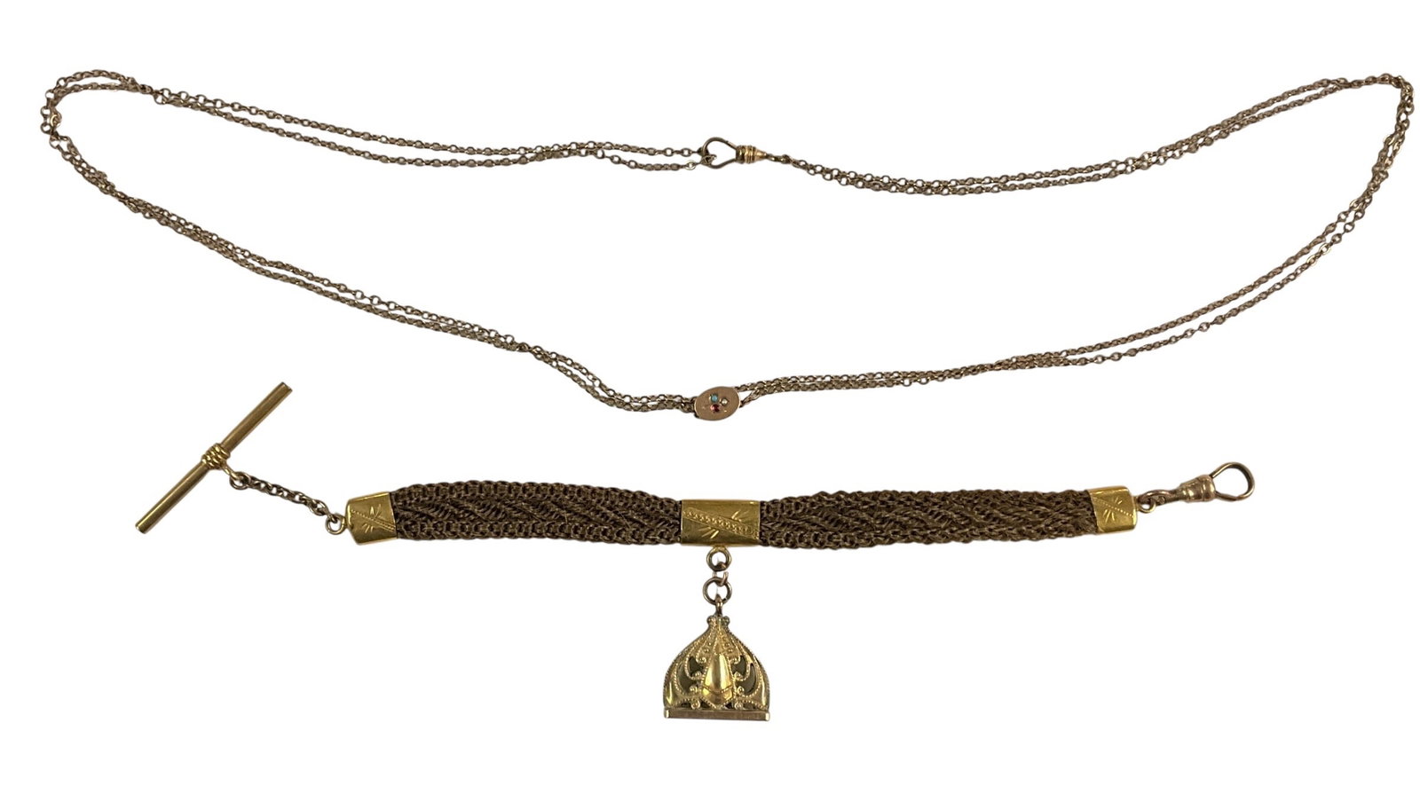 Antique Victorian Hair Bracelet with Gold Findings & Stick Pin Necklace: Victorian-era woven hair bracelet featuring intricate braided hairwork with gold-tone end caps and clasp. The bracelet is adorned with a decorative drop charm in an ornate openwork design. Included is
