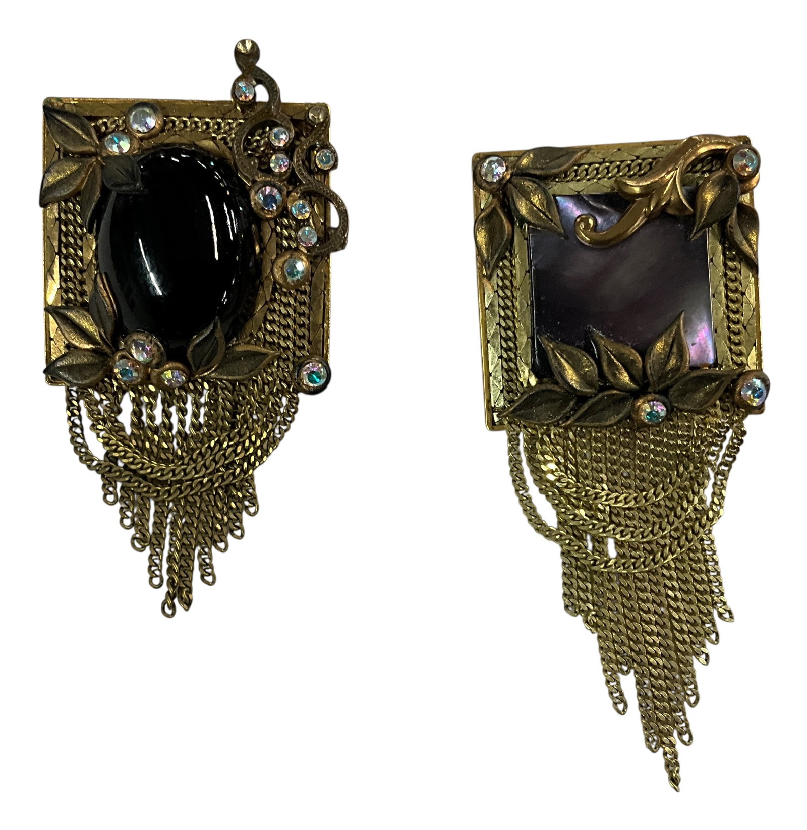 Pair of Marena Art Deco Revival Brooch/Pendants with Chain Fringe – Germany: Striking Marena Art Deco Revival jewelry set of brooch/pendants, both featuring ornate gilt metal construction with dramatic chain fringe drops. One showcases a Cabochon stone with a warm deep color, 